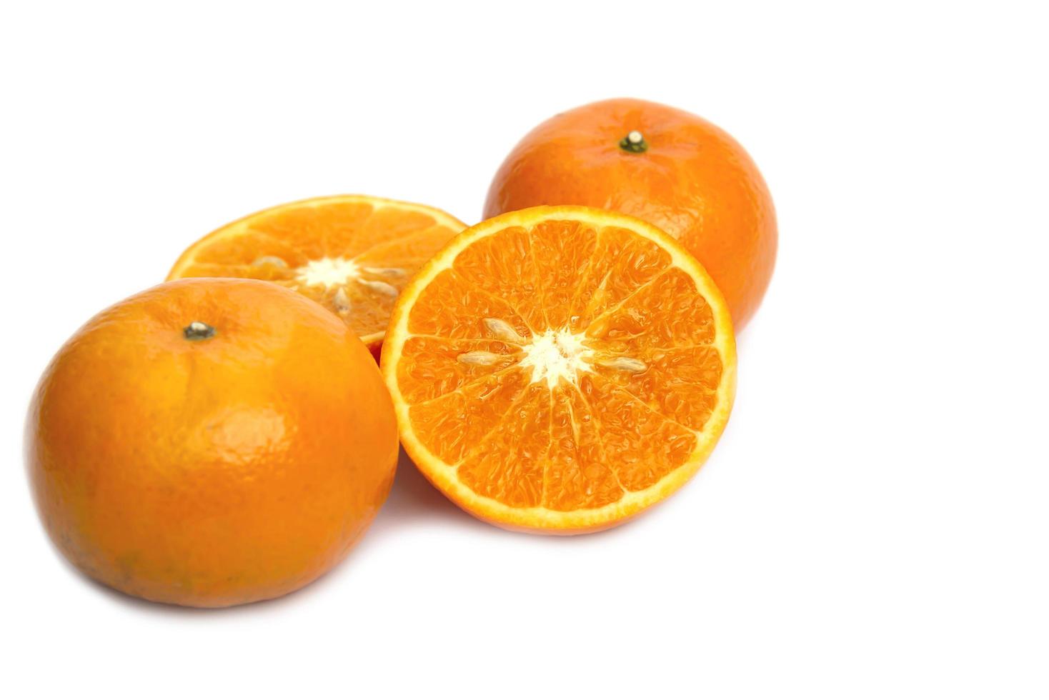 Fresh juicy orange fruit set over white background - tropical orange fruit for background use photo