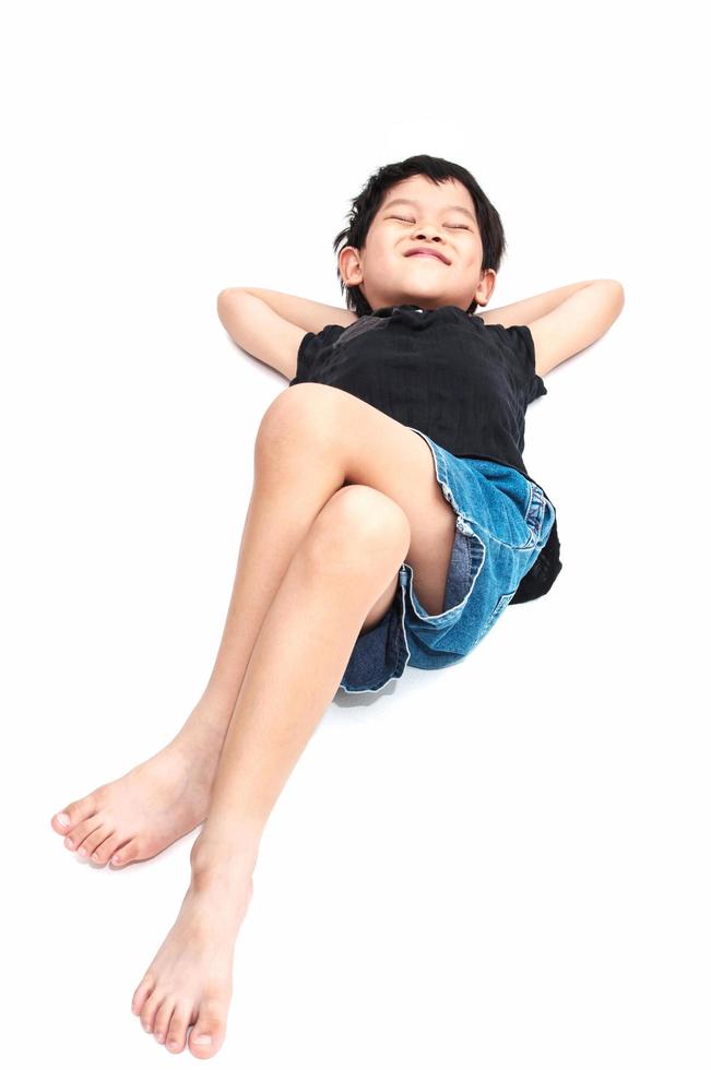 Isolated of relaxing boy lay down on the floor photo