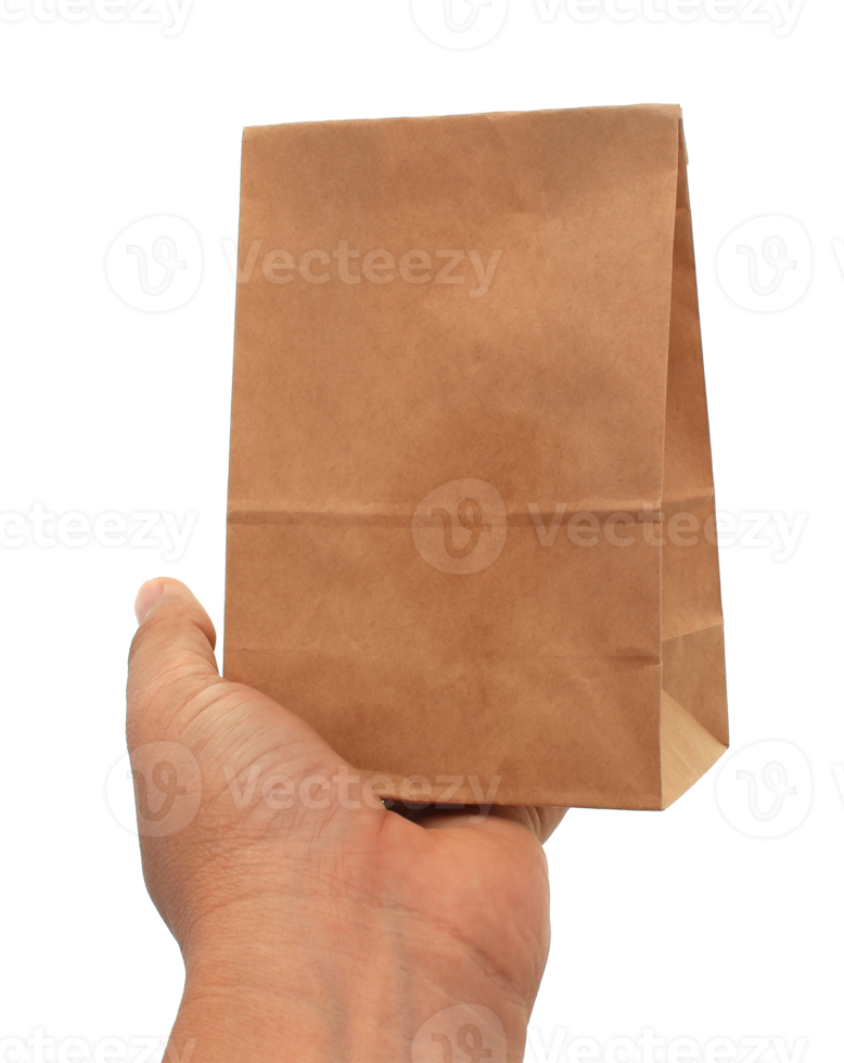 hand holding a brown paper bag png