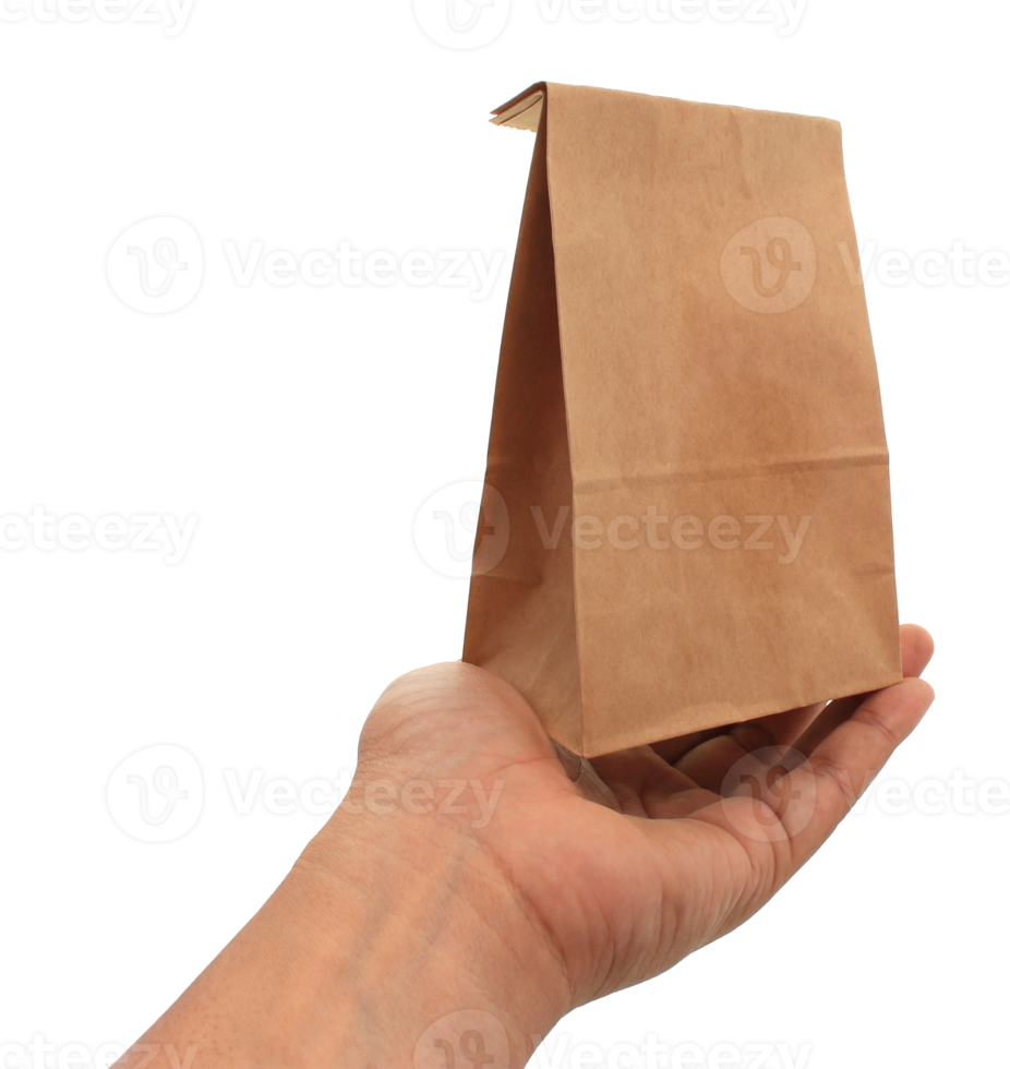 hand holding a brown paper bag on transparent background png file