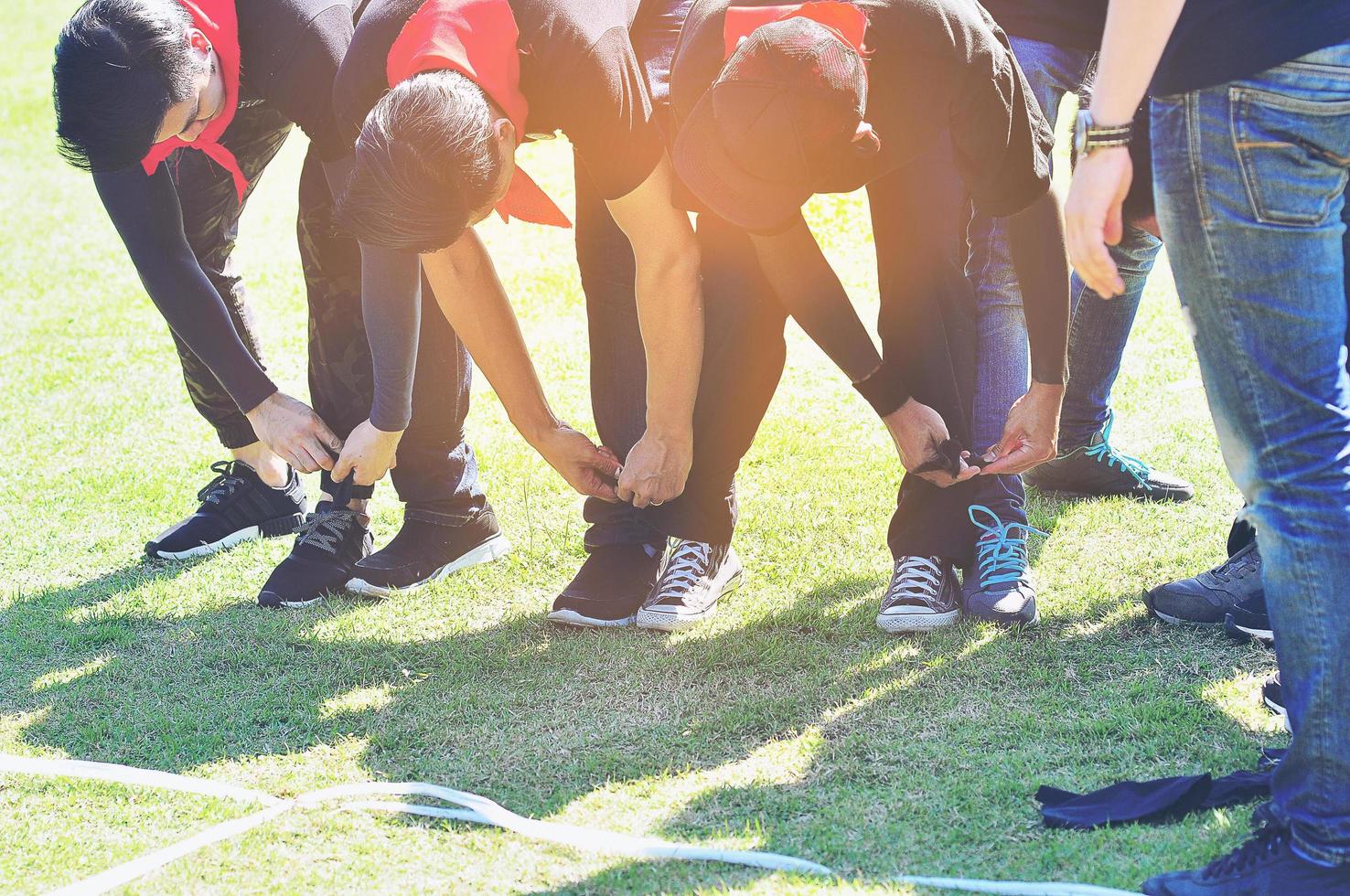 Five legged race outdoor party game, harmonious unity concept photo