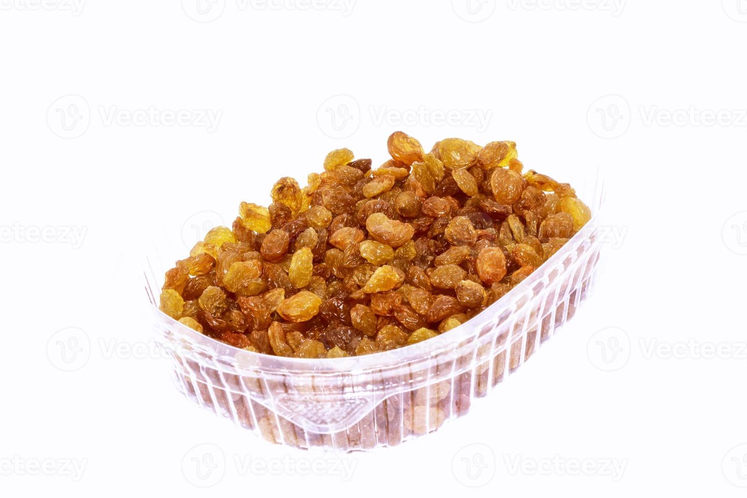 Dried raisins on white background. Tasty and healthy berry. photo