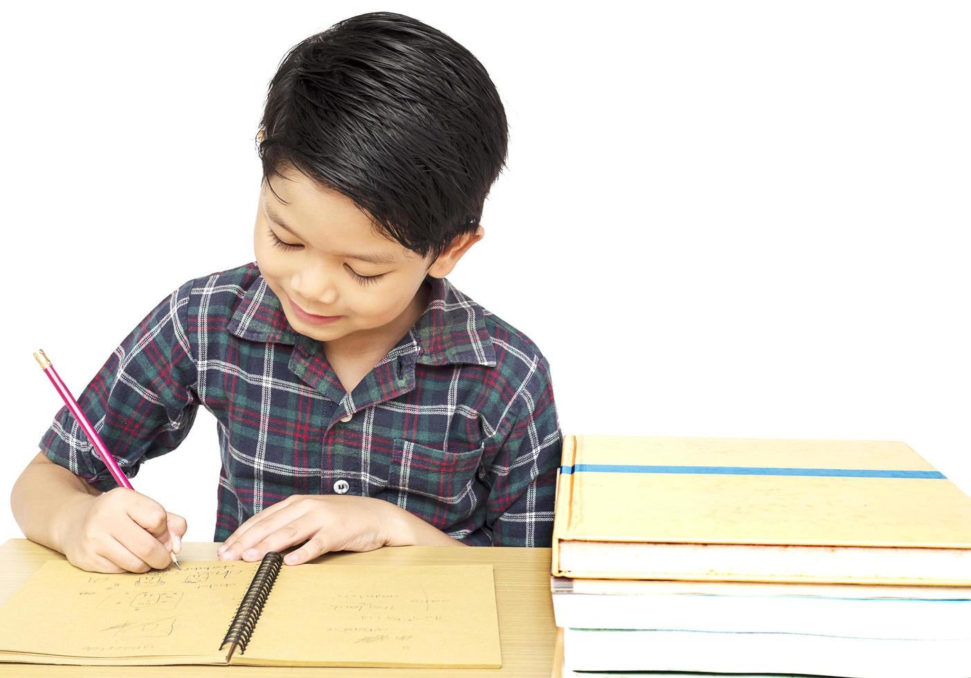 A boy is curiously doing homework photo