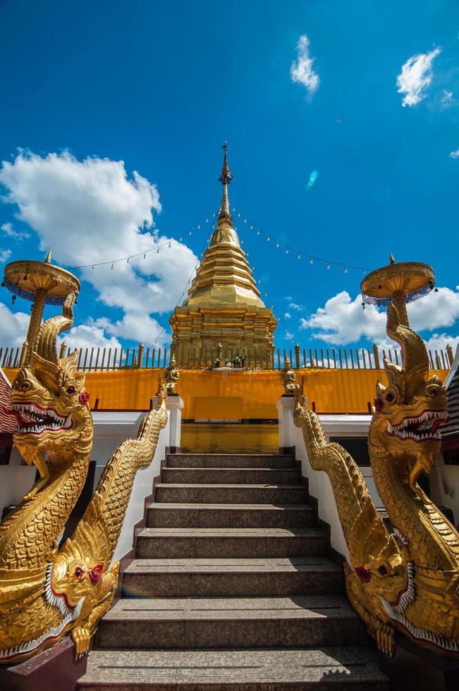 Well decorated stair to the pagoda of famous ancient temple in Chiang Mai Thailand Wat Phra That Doi Kham Temple of the Golden Mountain photo