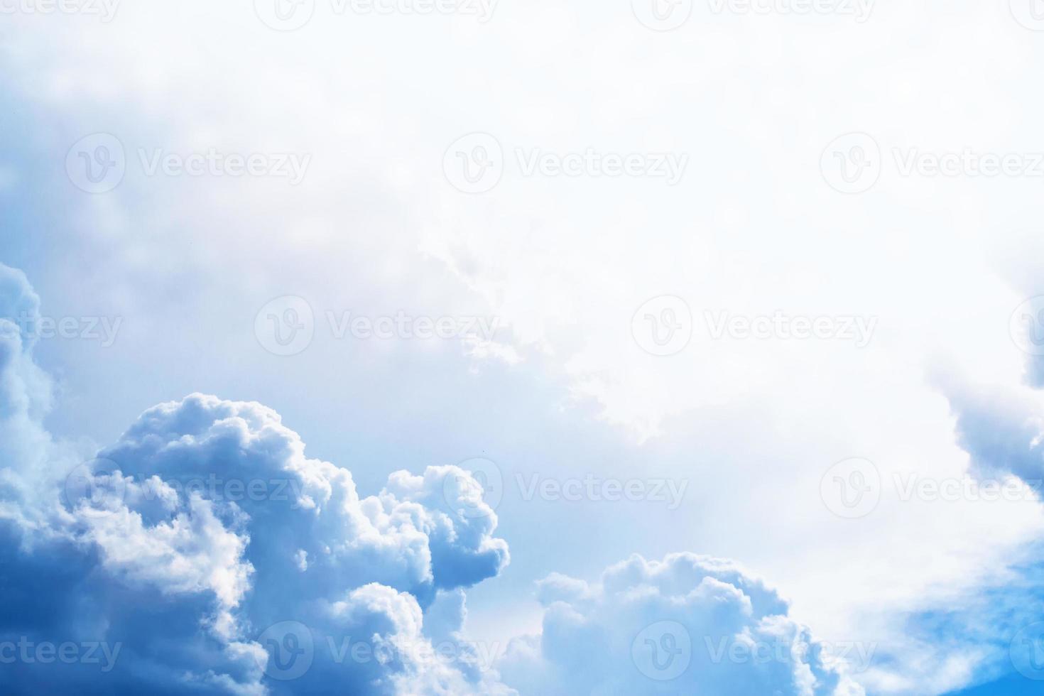 Blurred background. Blue sky and white fluffy clouds. photo