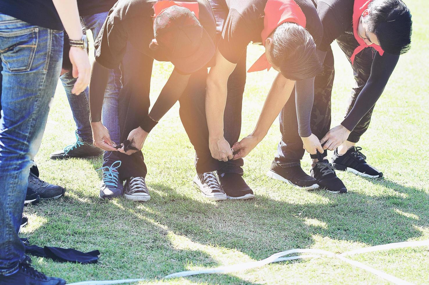 Five legged race outdoor party game, harmonious unity concept photo