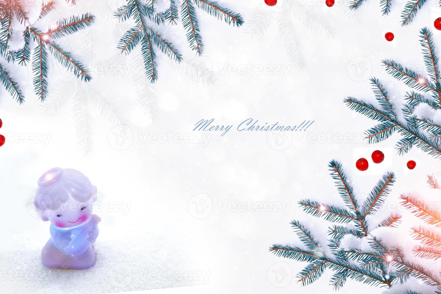 Little white angel in snowdrifts photo
