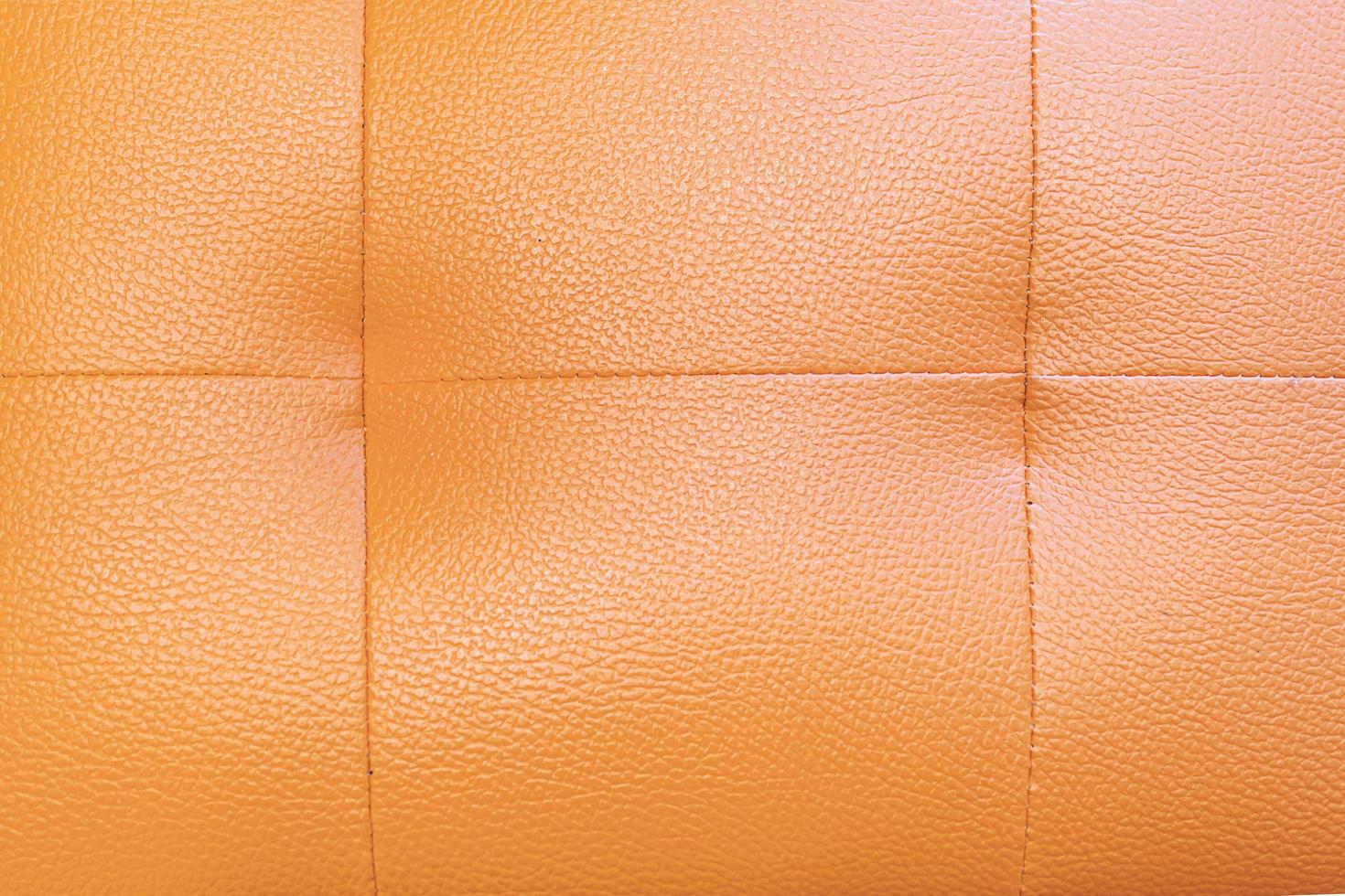 Orange sofa cover lather texture background photo