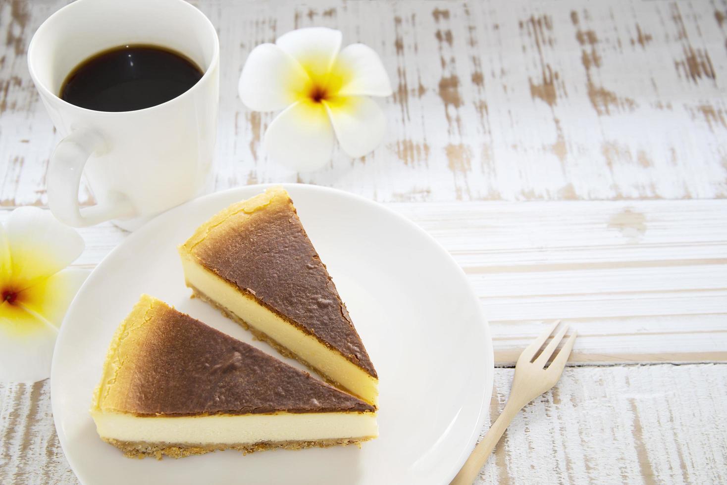 New York cheesecake on white wooden table - homemade cooking bakery concept photo