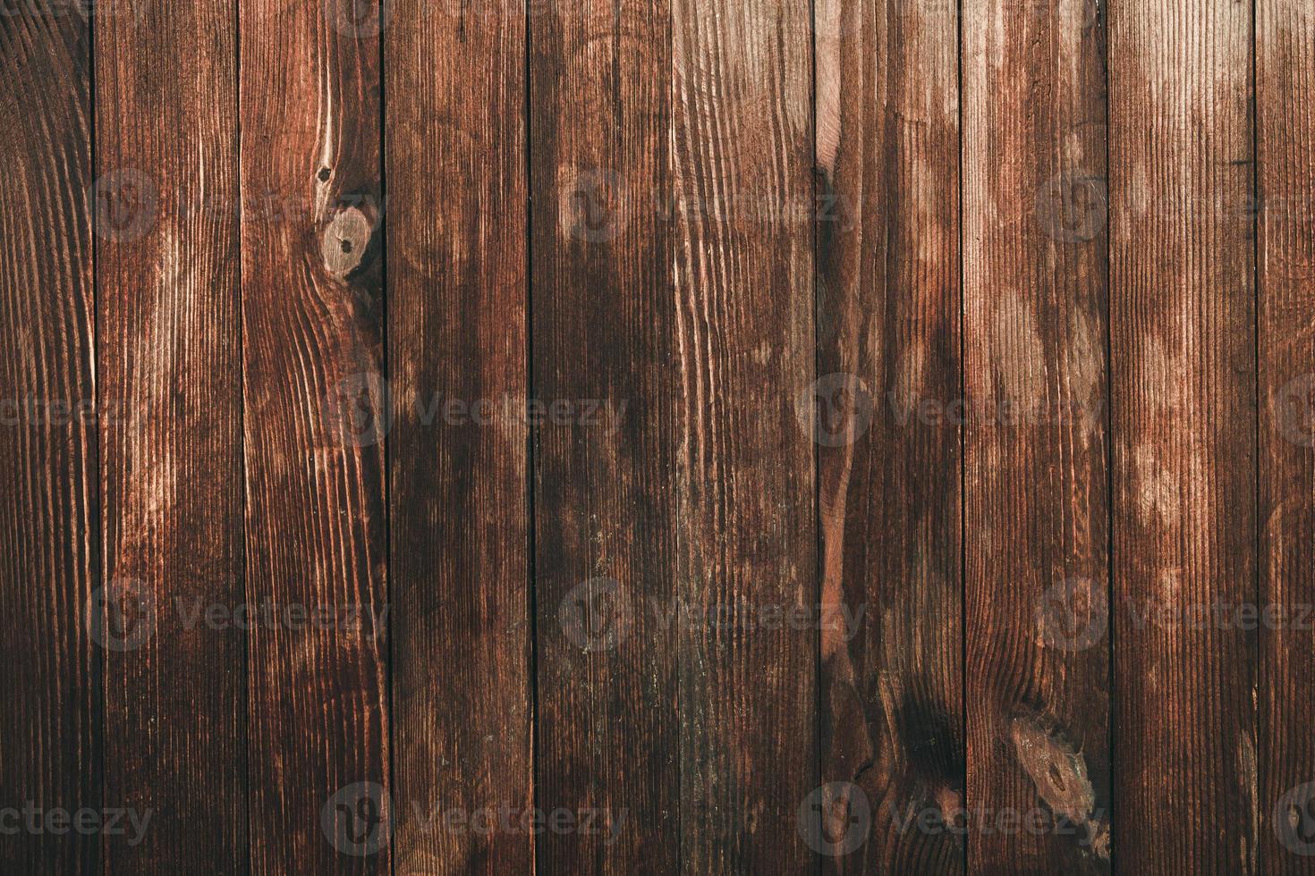 Vintage brown wood background texture with knots and nail holes. Old painted wood wall. Brown abstract background. Vintage wooden dark horizontal boards. Front view with copy space photo