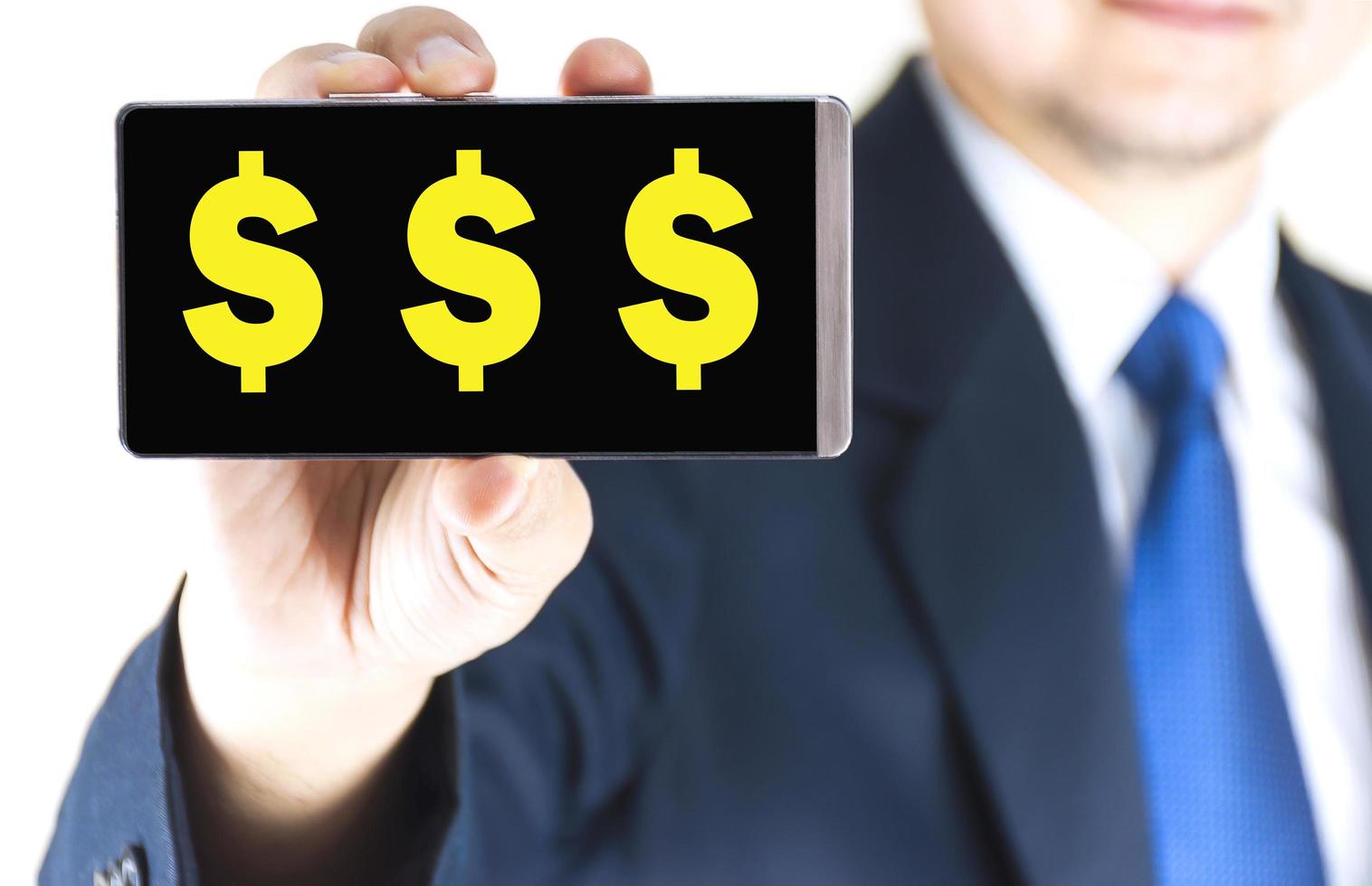 Word on mobile phone screen in blurred young businessman hand over white background, business concept photo