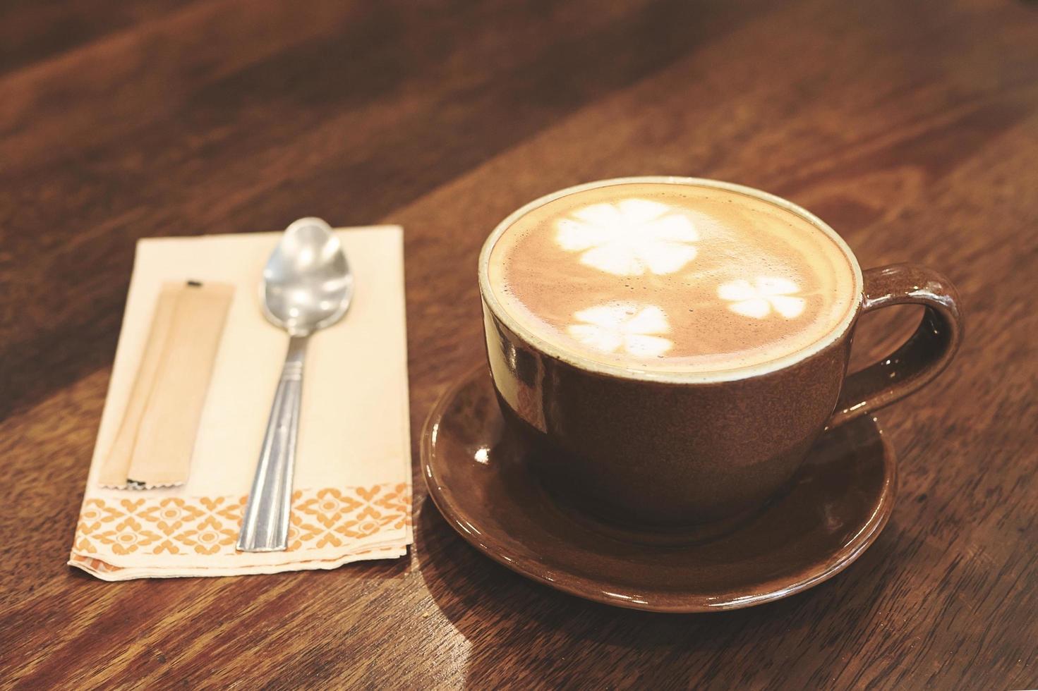 Vintage coffee with Latte art decoration photo