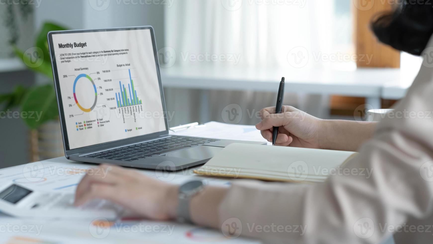 Close up view of bookkeeper or financial inspector hands making report, calculating or checking balance. Home finances, investment, economy, saving money or insurance concept photo