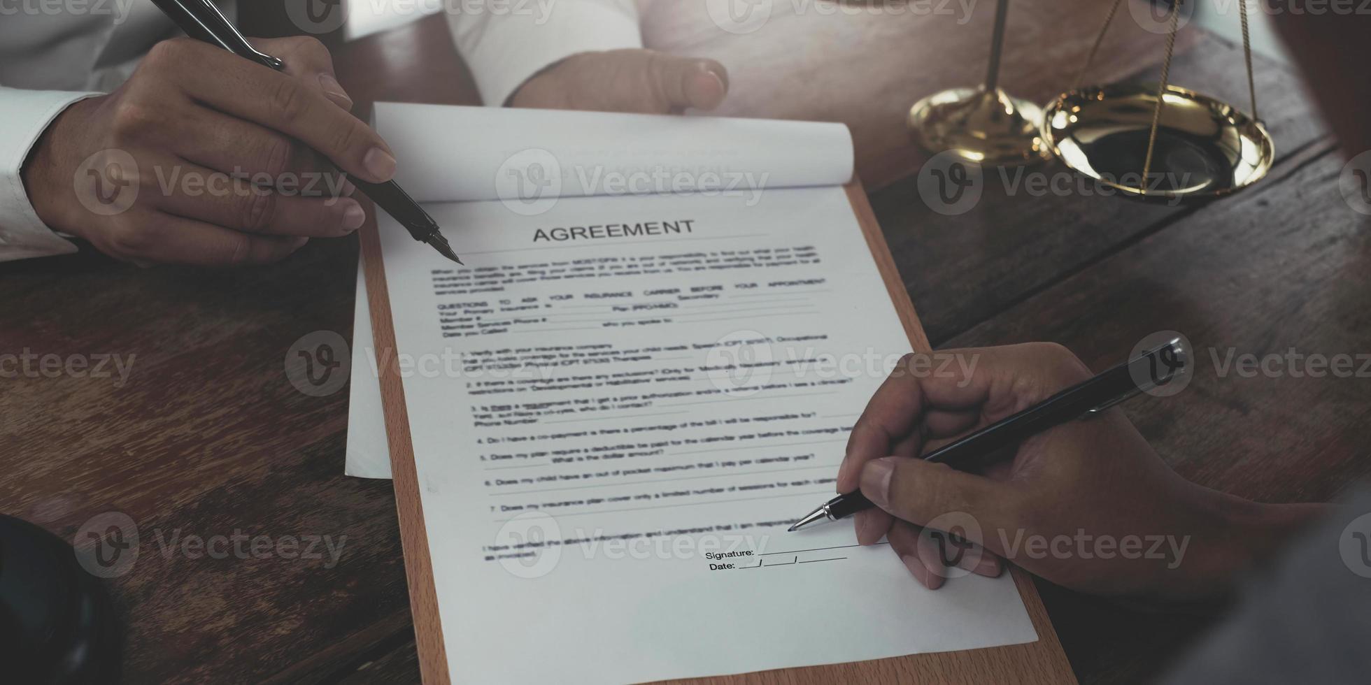 Business and lawyers discussing contract papers with brass scale on desk in office. Law, legal services, advice, justice and law concept picture with film grain effect photo