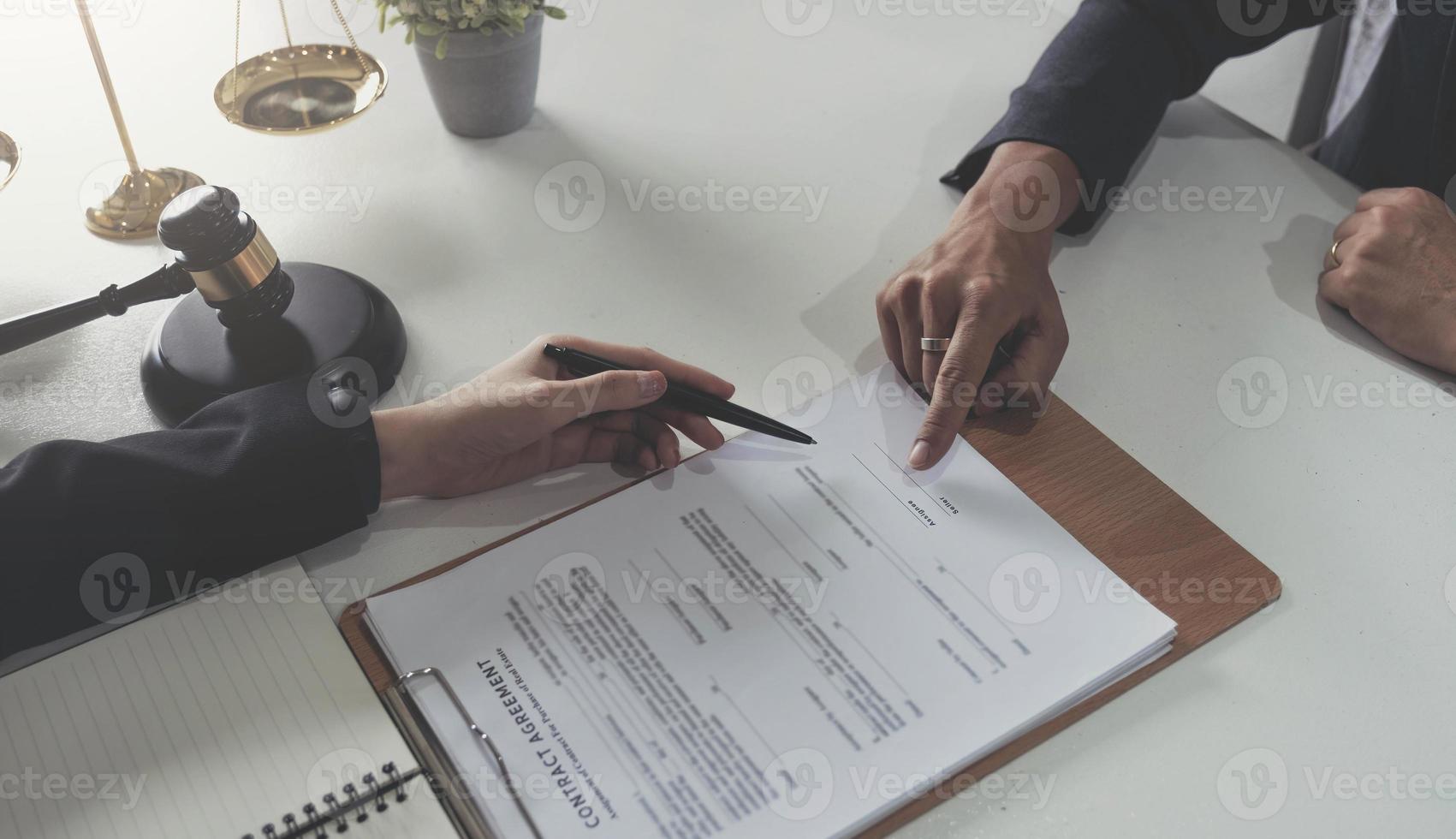 business people working together at meeting in modern office, close-up. Businessman and woman with colleagues or lawyers discussing contract at negotiation photo