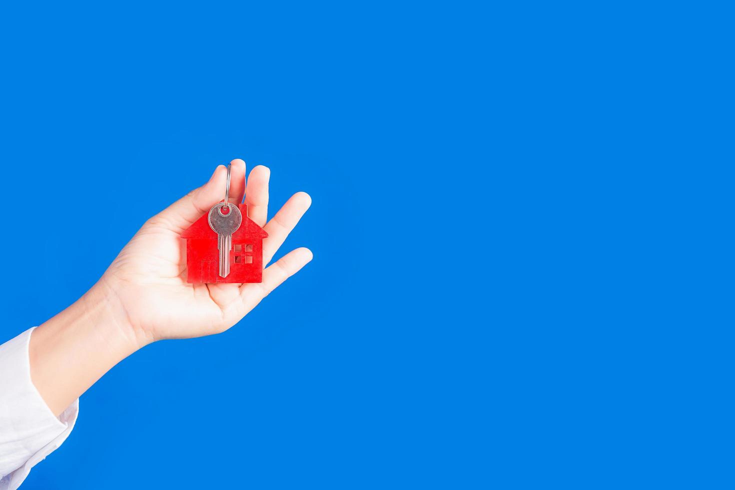 house keys on blue background 9312017 Stock Photo at Vecteezy