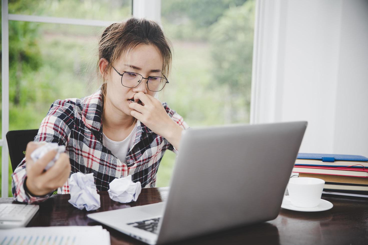 woman sitting down, his face unsettled photo