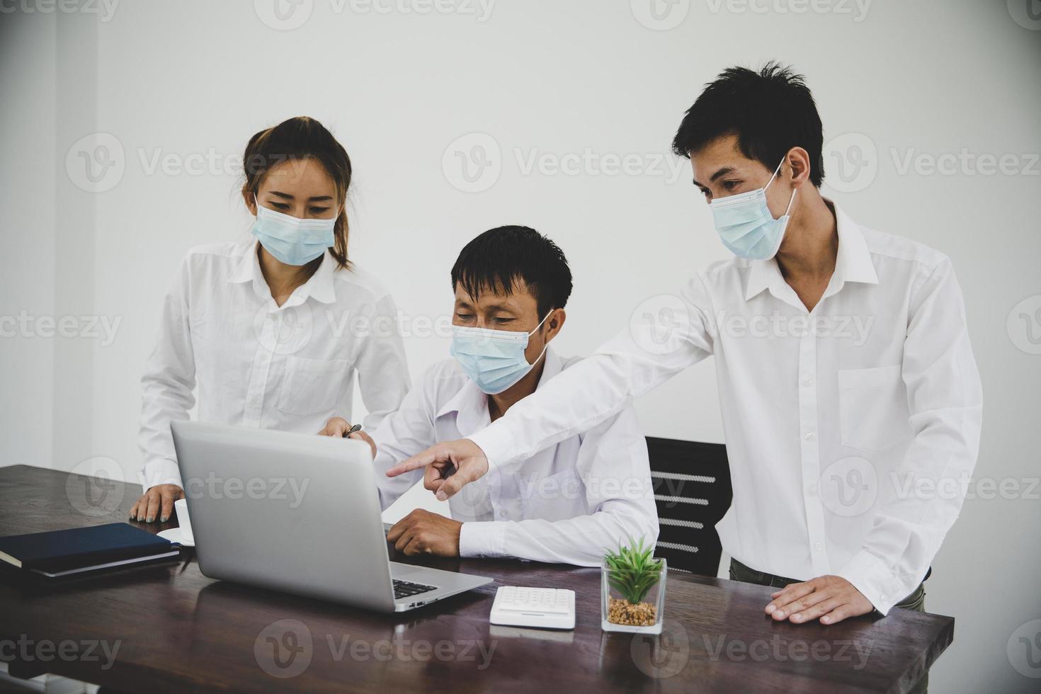Group business people communicate working with laptop in office photo