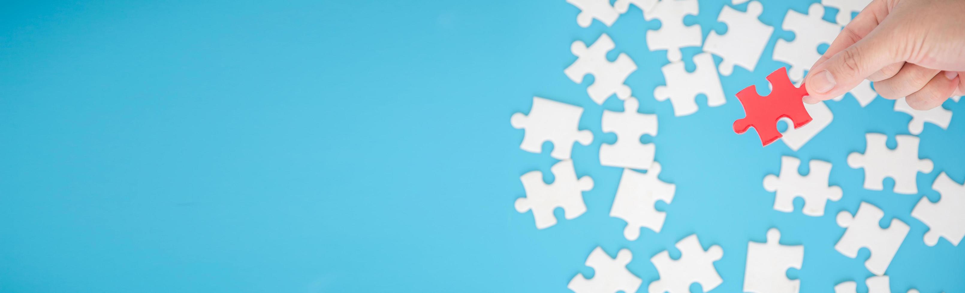 Top view of jigsaw puzzle on blue background photo