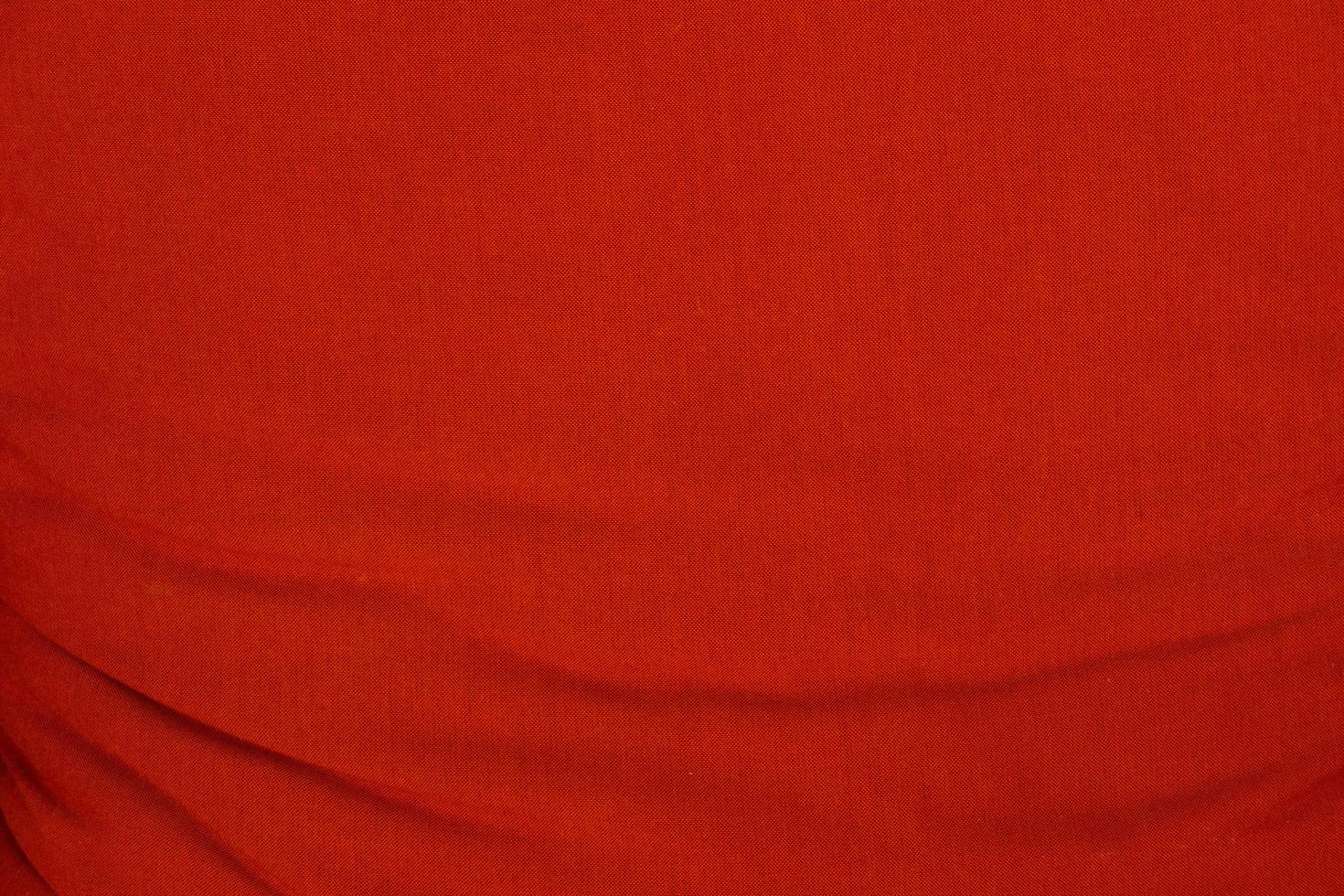 Red wrinkled fabric texture for background photo