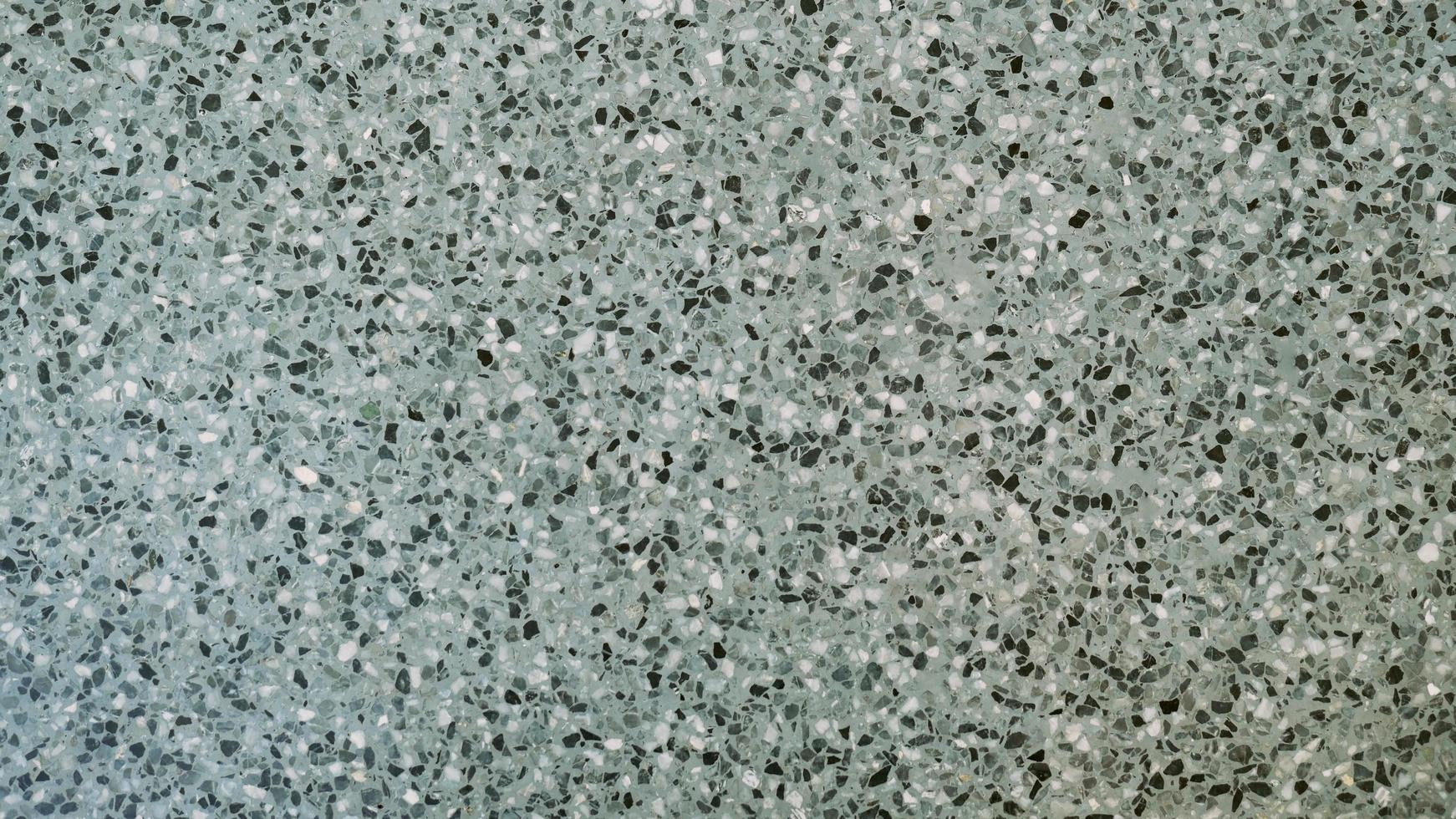 The cement wall was weathered, the surface was scratched, the surface was scratched and damaged. For a mysterious retro-conservative background. photo