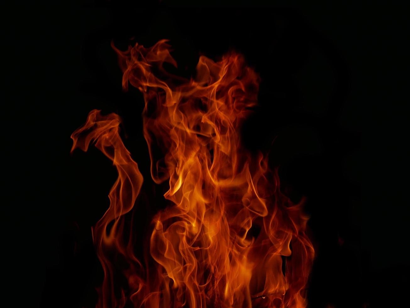 Flame Flame Texture For Strange Shape Fire Background Flame meat that is burned from the stove or from cooking. danger feeling abstract black background Suitable for banners or advertisements. photo
