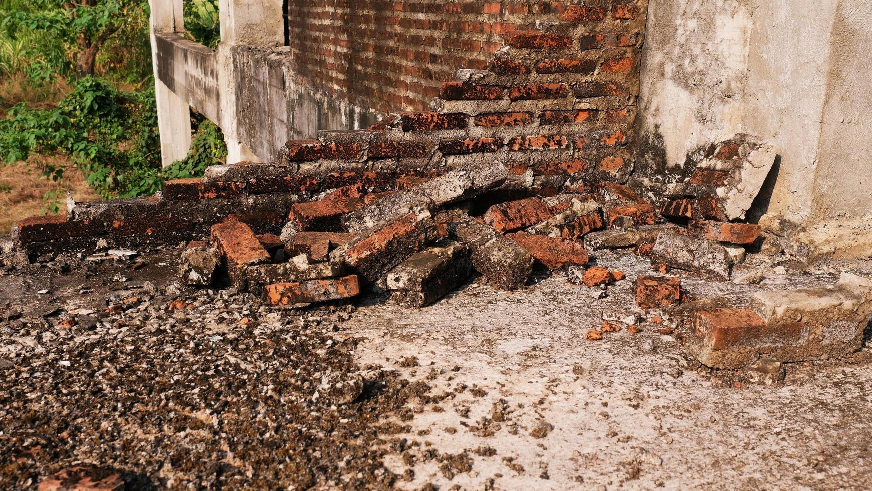 Close-up of the rubble of an industrial building collapsing into a pile of concrete and brick. and the jagged debris caused by the failure of the engineers at the abandoned construction. photo