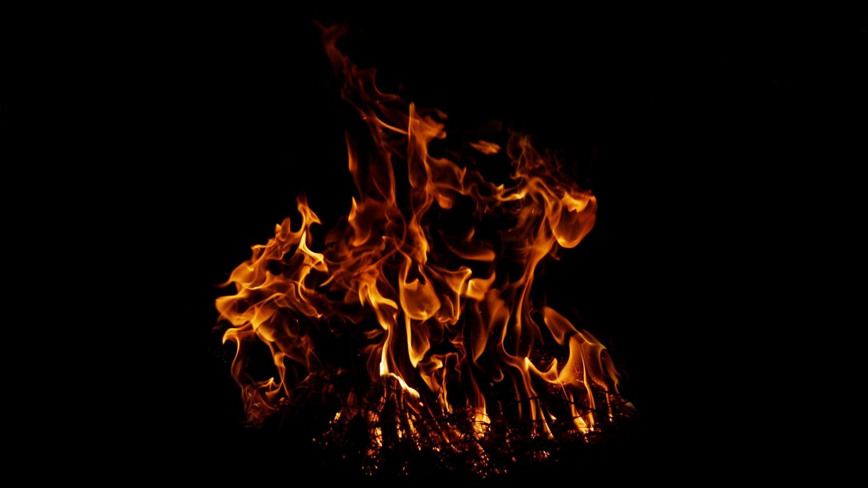 Haystack fires at night in arid areas The ash erupted and the wind was very dangerous. ashes red as hell. photo