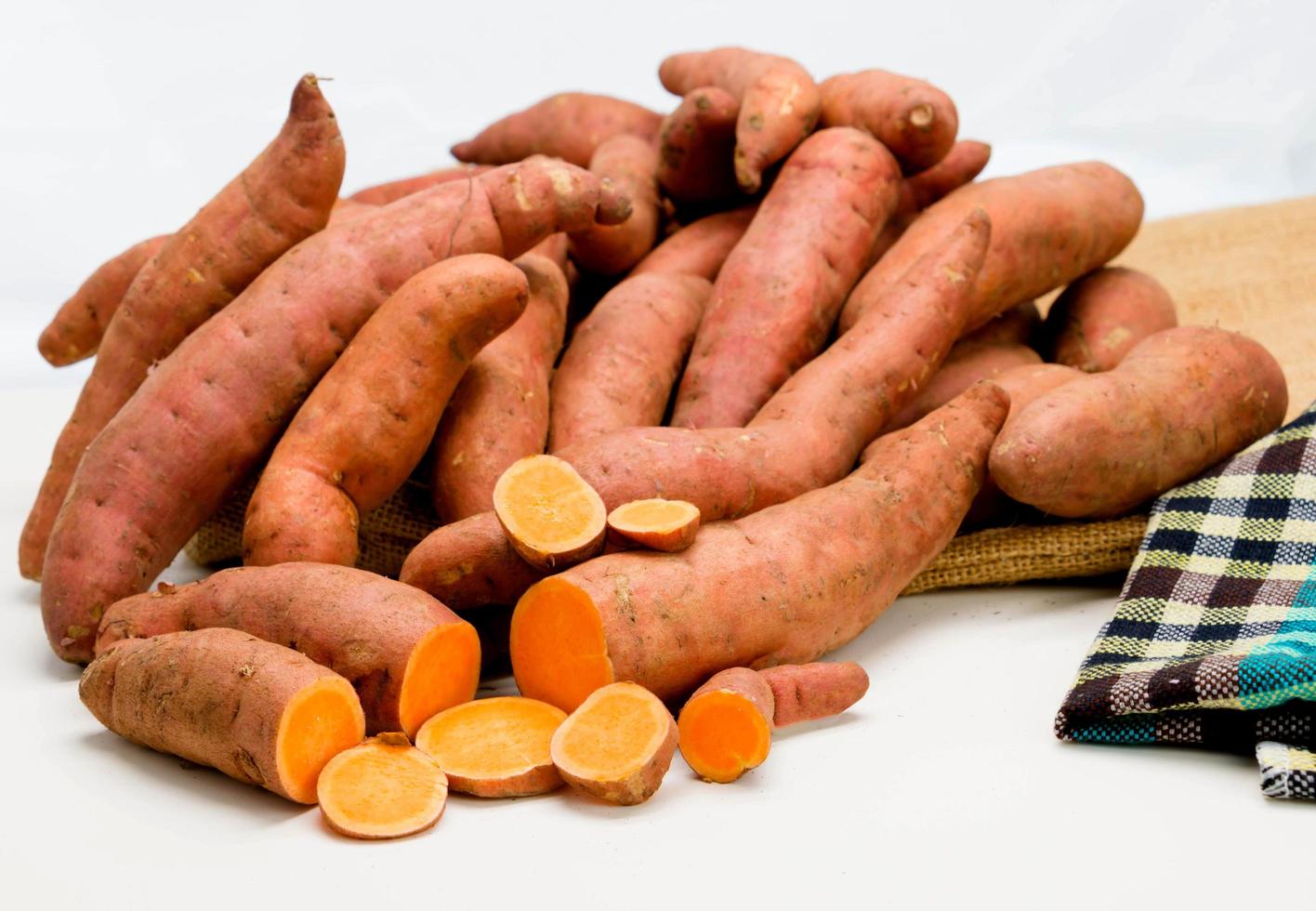 sweet potatoes on white photo