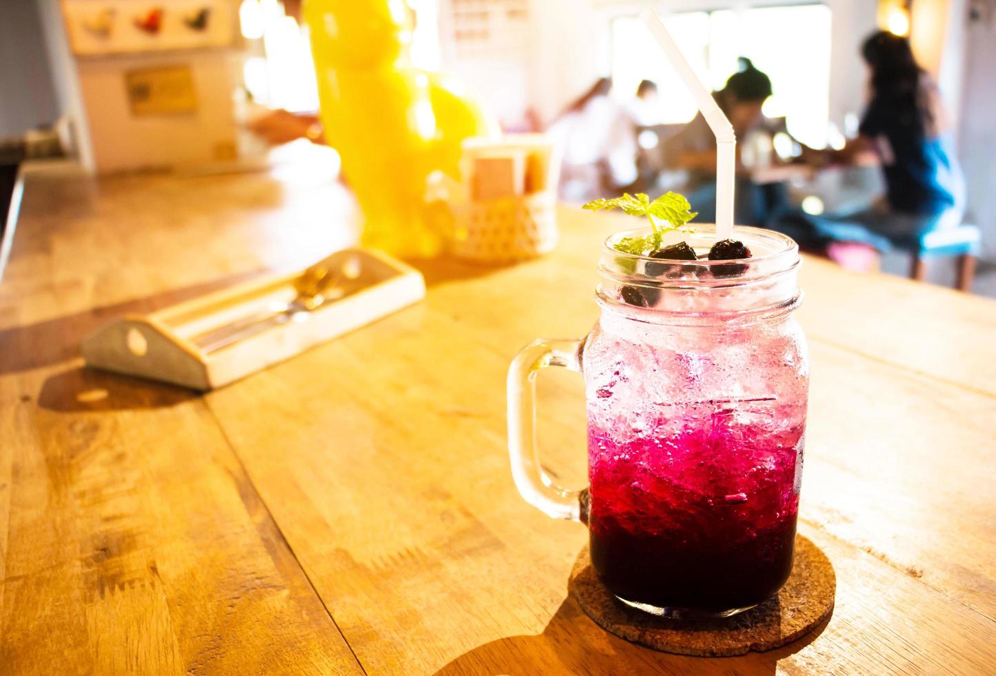 glass of blueberry soda photo