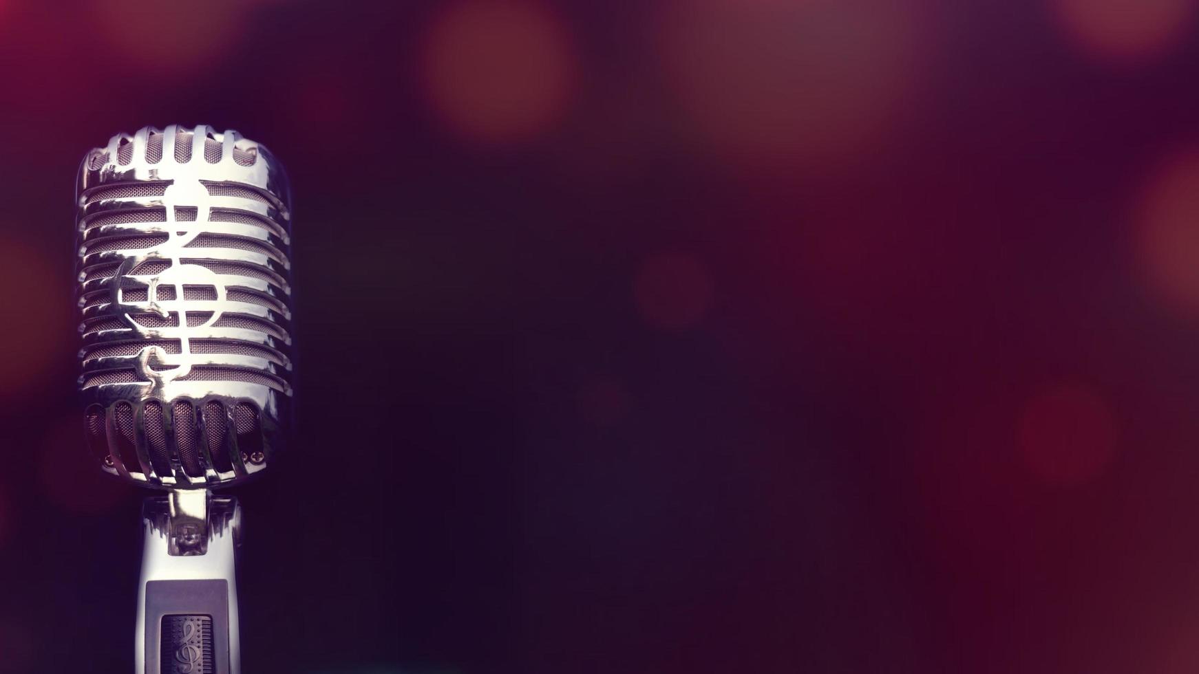 Retro microphone for recording and performing for singers on stage. Bokeh light background can put advertising text. photo