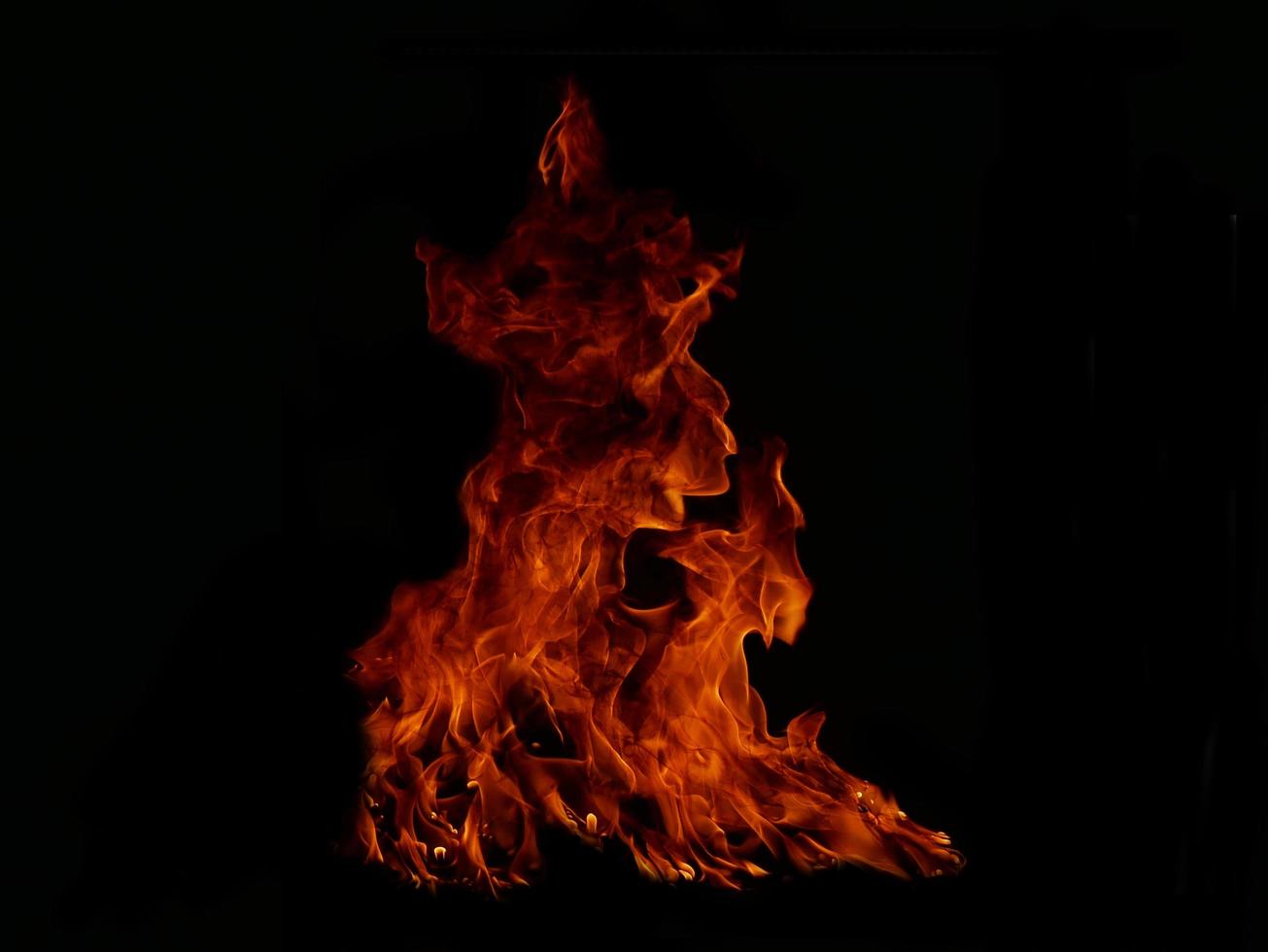 Flame Flame Texture For Strange Shape Fire Background Flame meat that is burned from the stove or from cooking. danger feeling abstract black background Suitable for banners or advertisements. photo