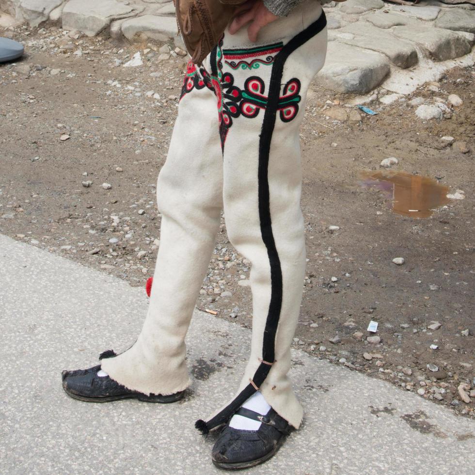 Close up of an unrecognizable man with zakopane traditional troussers. Poland photo