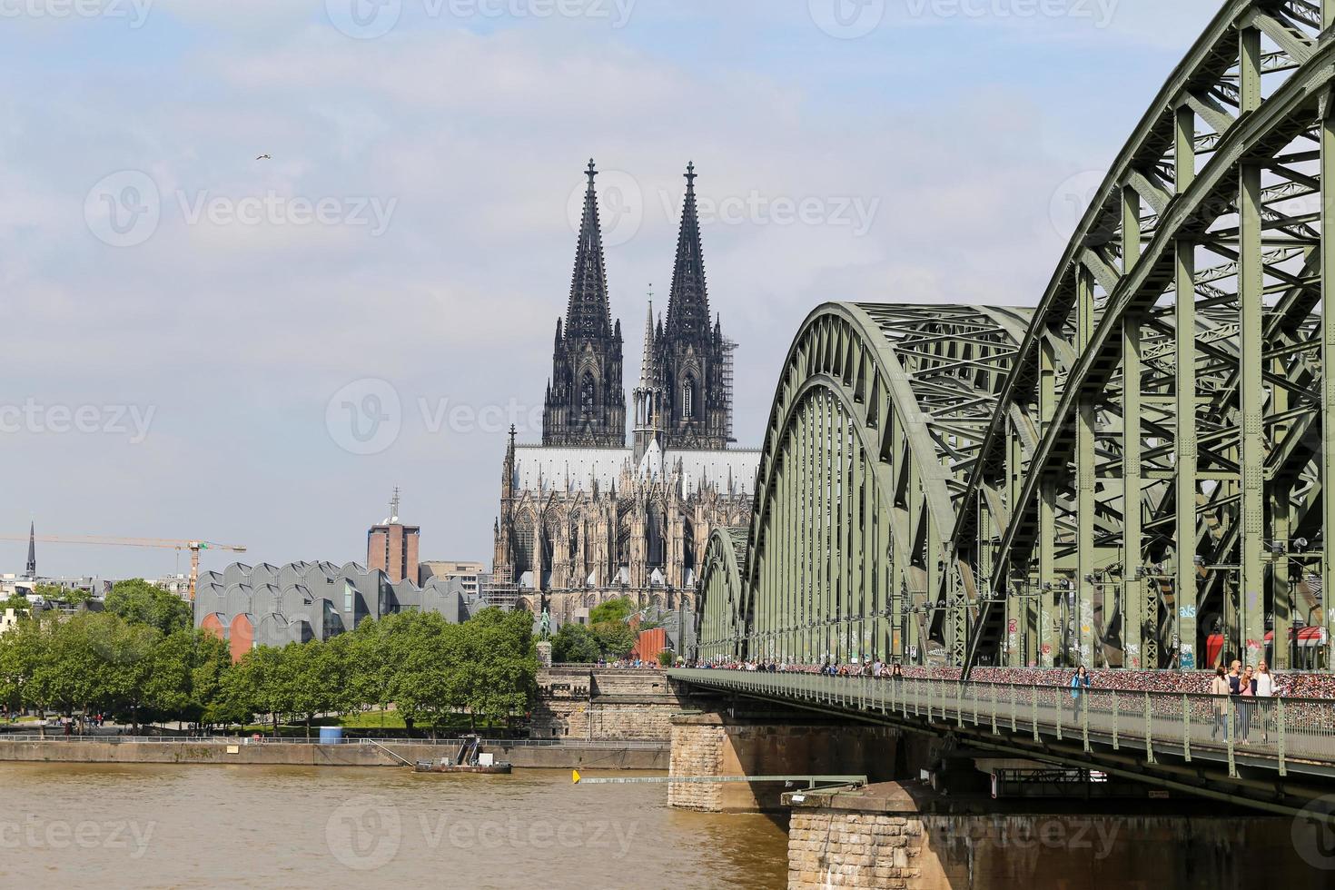 Hohenzollern Bridge and Cologne Cathedral in Cologne, Germany photo