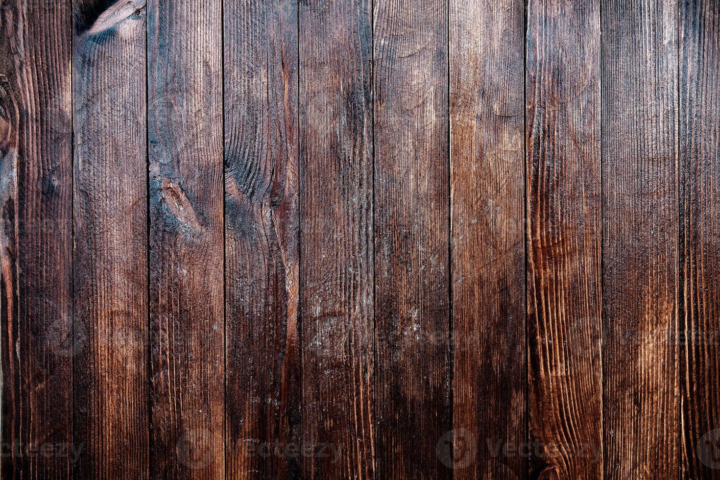 Vintage brown wood background texture with knots and nail holes. Old painted wood wall. Brown abstract background. Vintage wooden dark horizontal boards. Front view with copy space photo