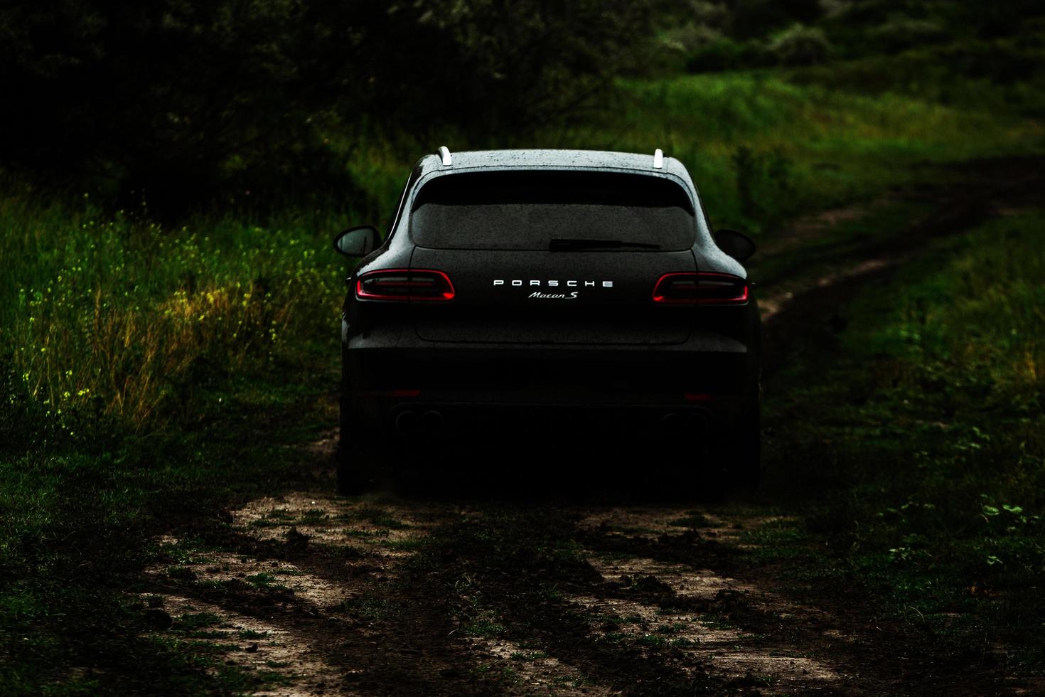 CHISINAU, MOLDOVA - JUNE 17, 2021, Porsche Macan S in off-road racing full of mood on bad road in Moldova. Editorial photo. photo