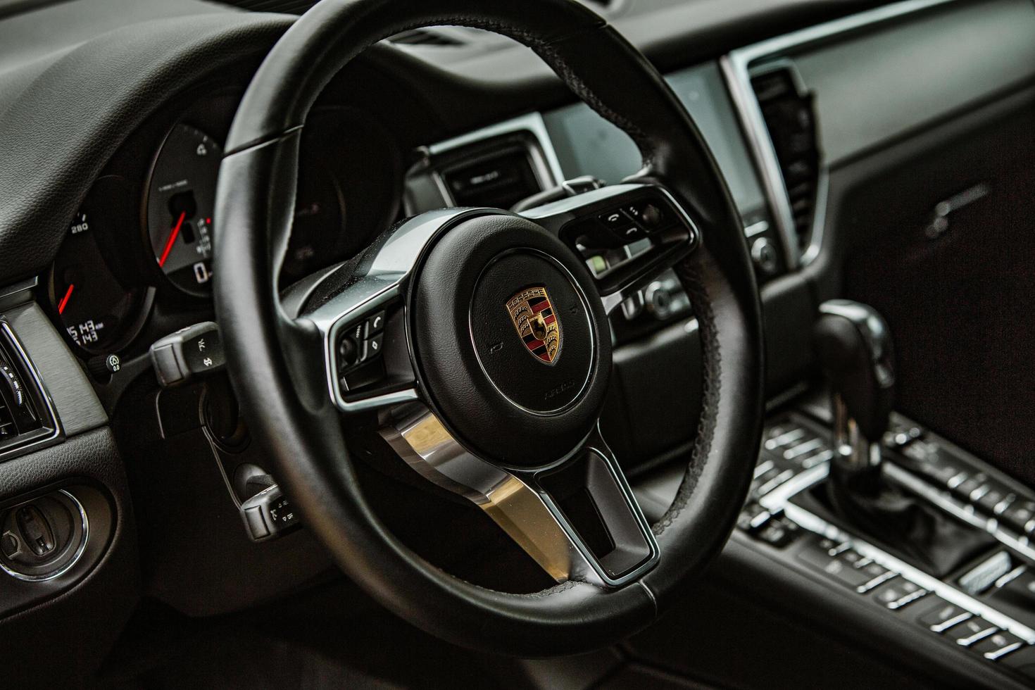 CHISINAU, MOLDOVA - JUNE 17, 2021, Porsche Macan S in off-road racing full of mood on bad road in Moldova. Editorial photo. photo