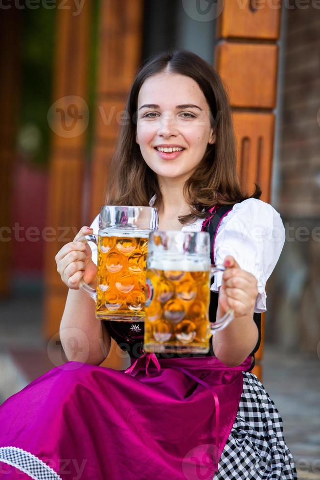 Sexy russian woman in Bavarian dress holding beer mugs. 9322067 Stock ...
