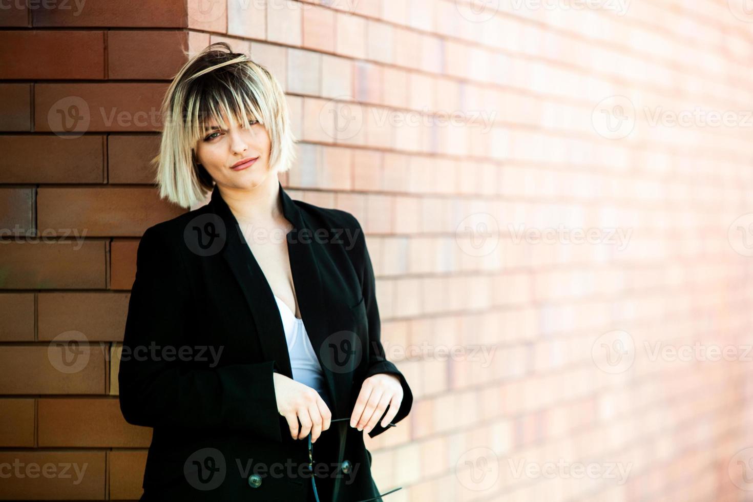 Confident business expert. Happy successful professional posing near office building. European girl. Russian business lady. Female business leader concept. Portrait Of Successful Business Woman photo