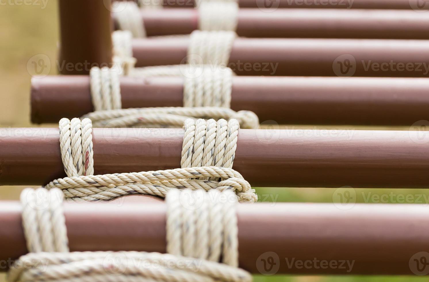 Rope knot around metal pipe photo