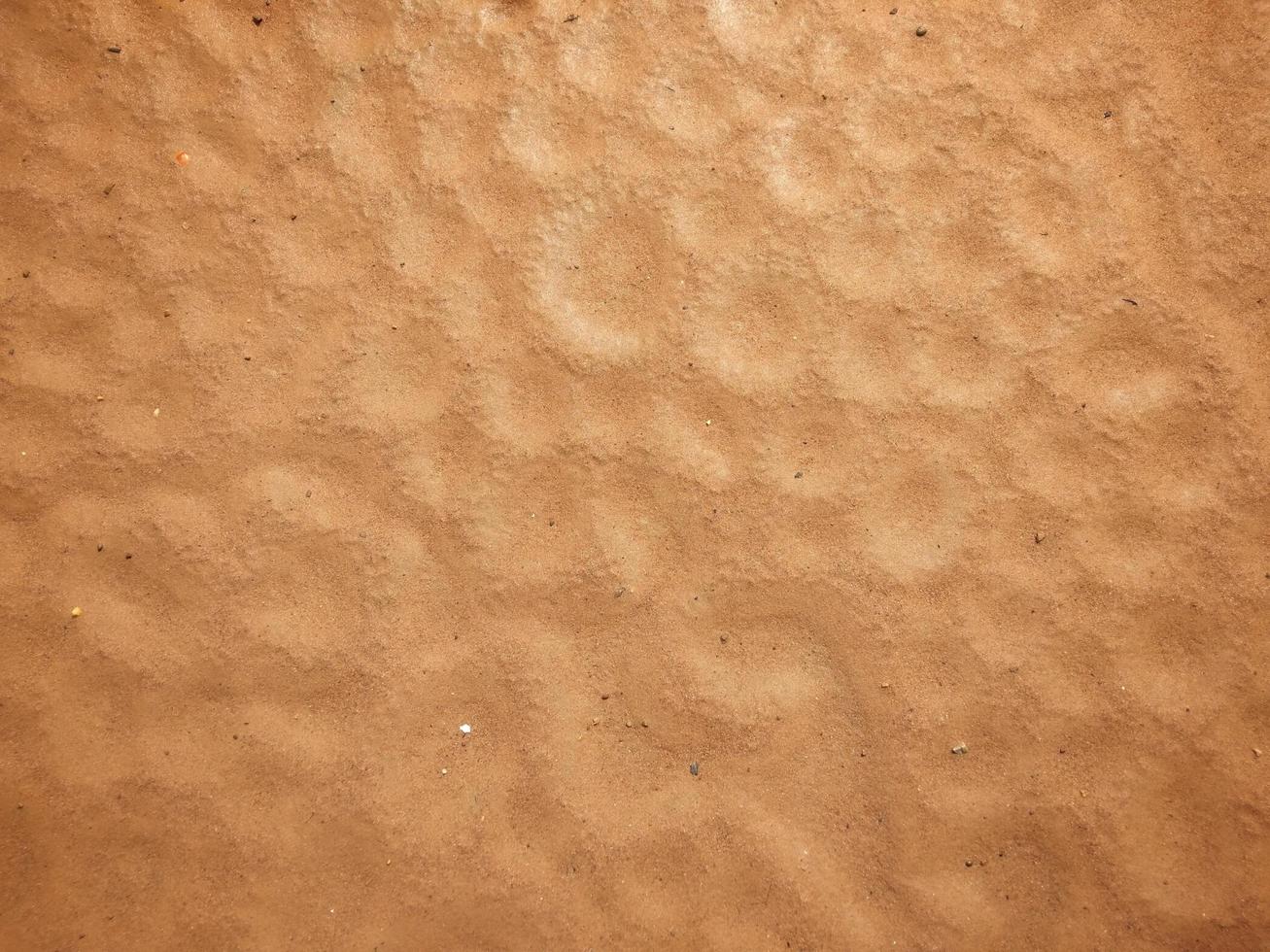 The red sand pattern looks like a hole.  Caused by natural raindrops, used as a background, wallpaper and design. photo