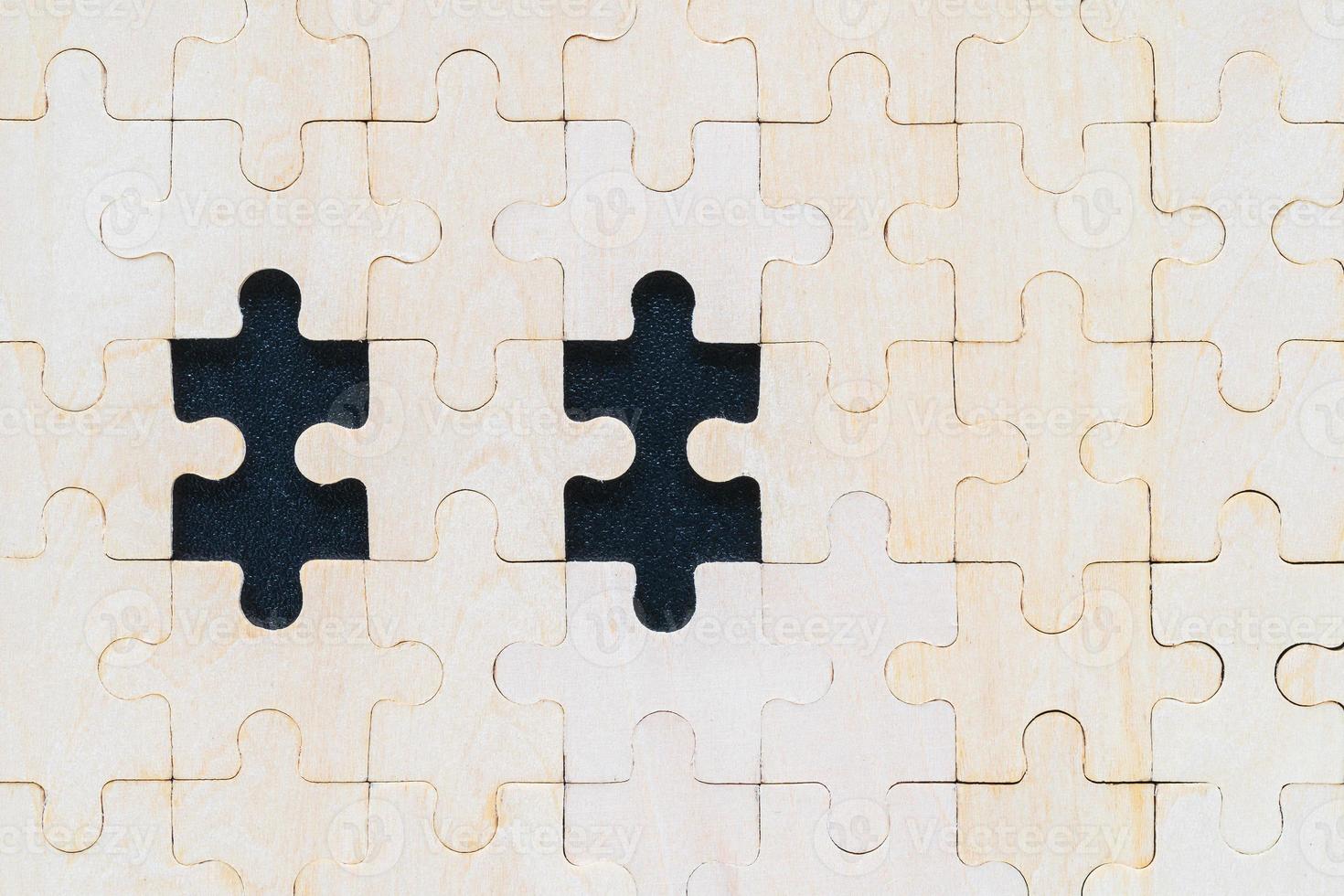 Close up wooden jigsaw puzzle pieces on black background 9322439 Stock