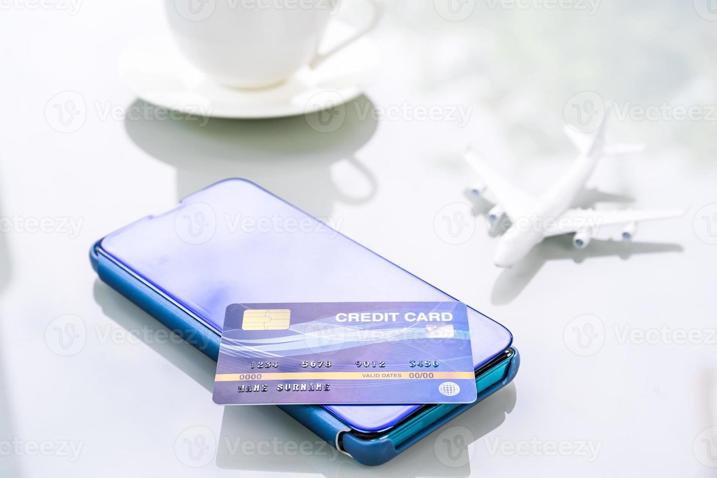 Smartphone with credit card on deck photo