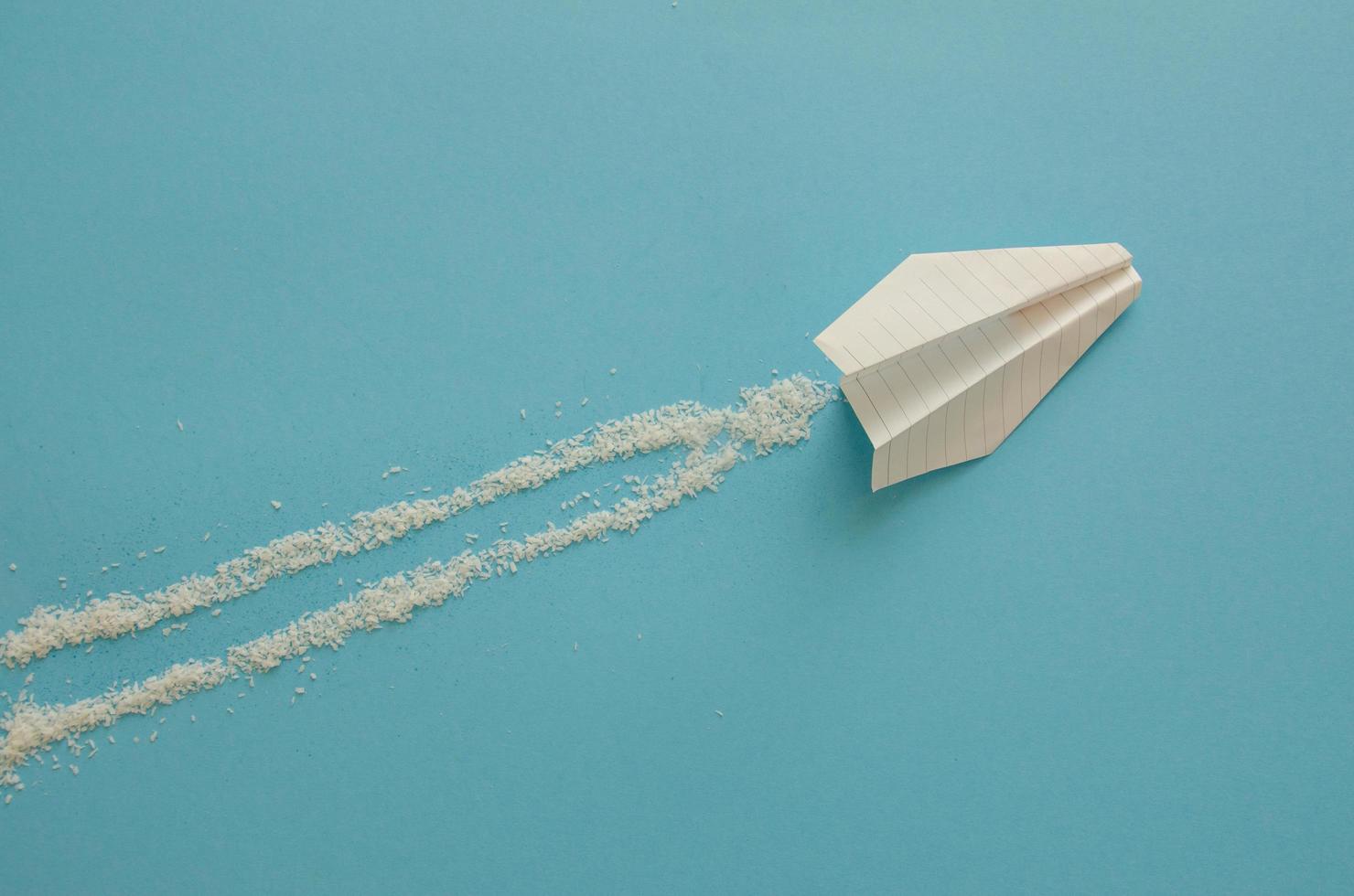 paper plane on a blue background, minimalism photo