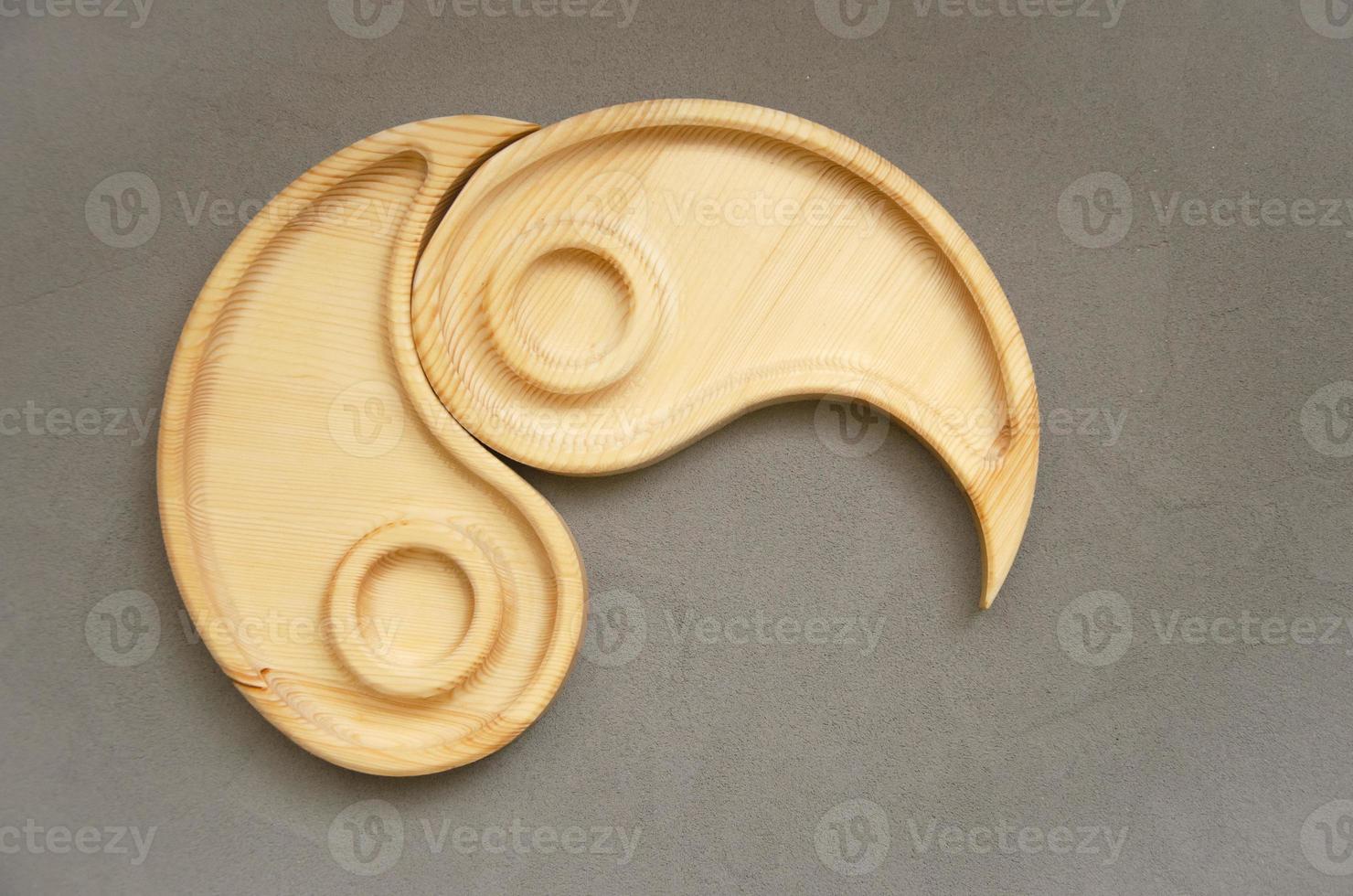 Portioned wooden yin yang dish on a gray background. Empty plate or tray, top view. combination plate photo