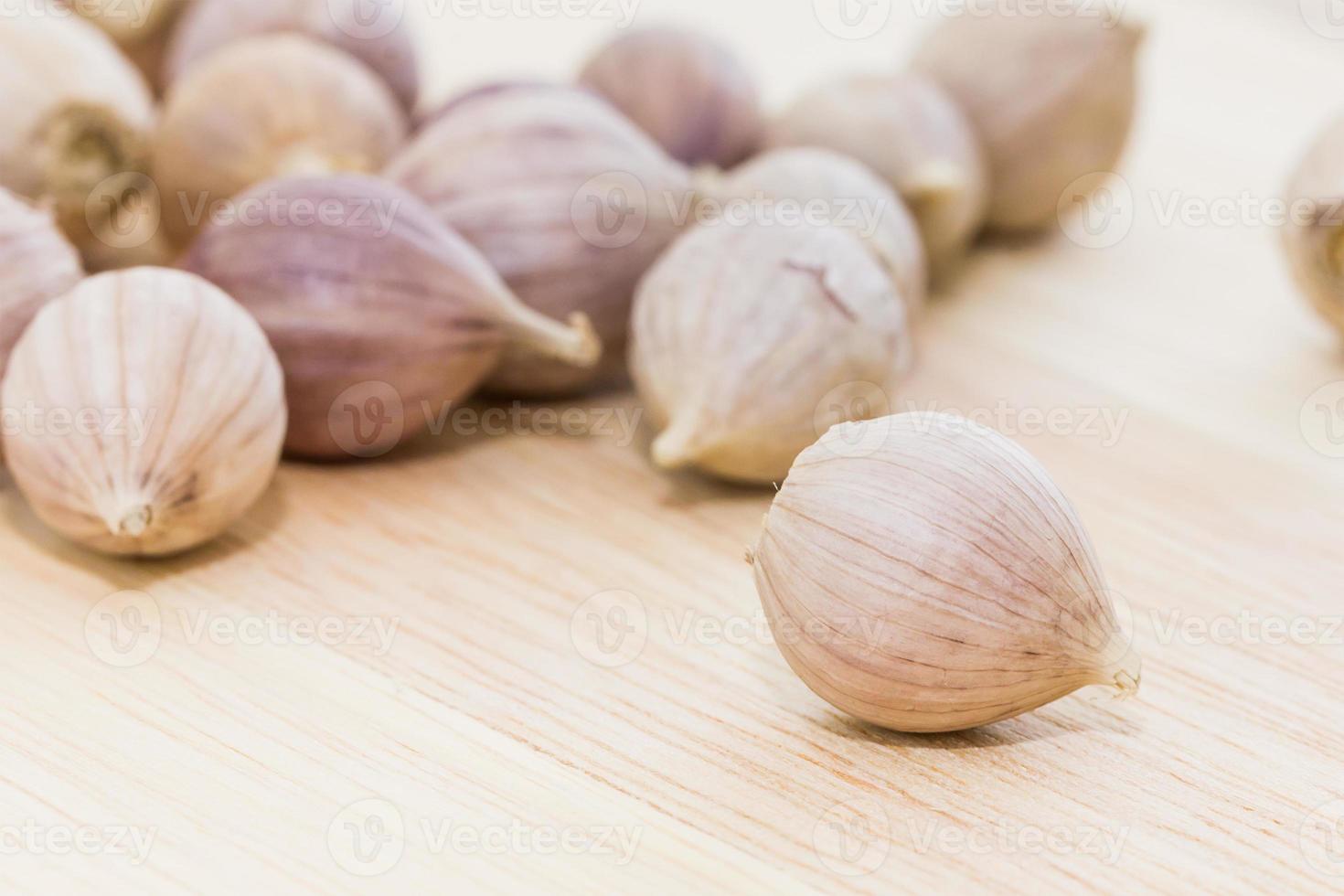 Garlic on wood table photo