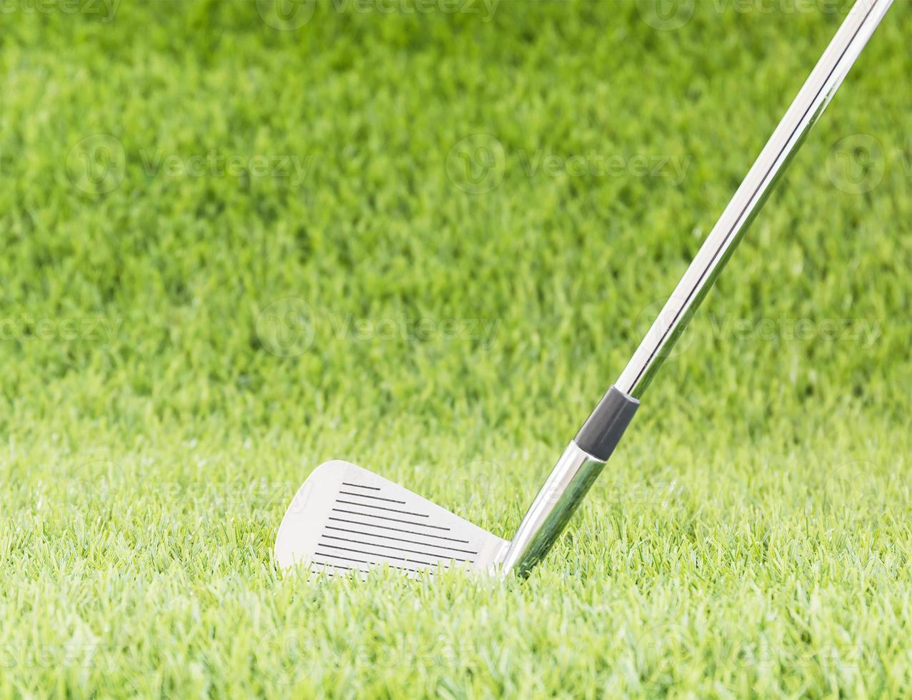 Golf club on green grass photo
