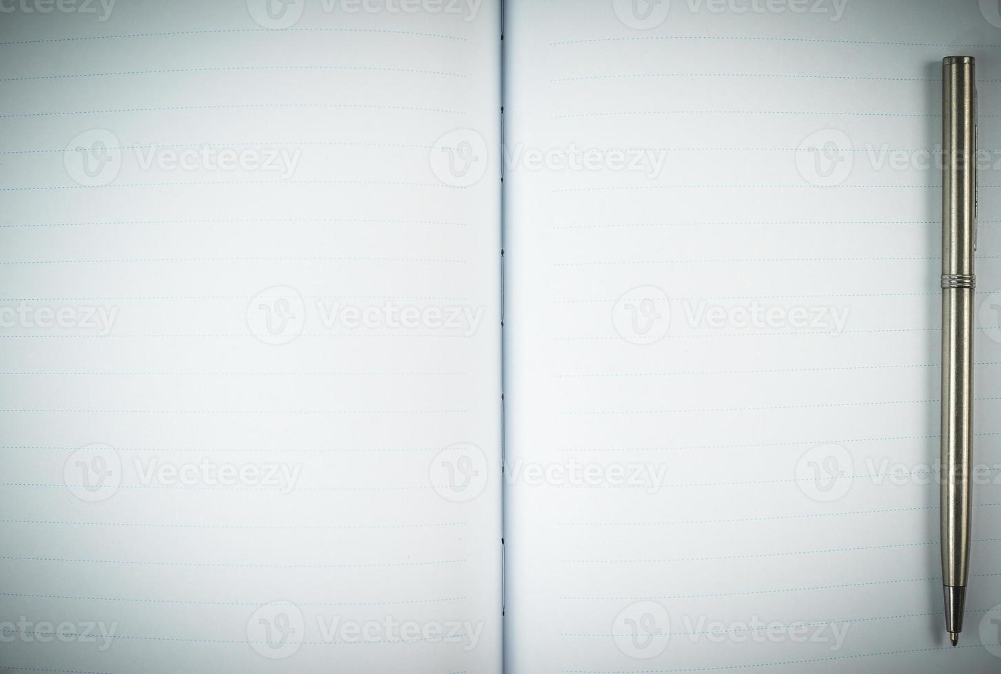 Blank notebook diary with silver pen photo
