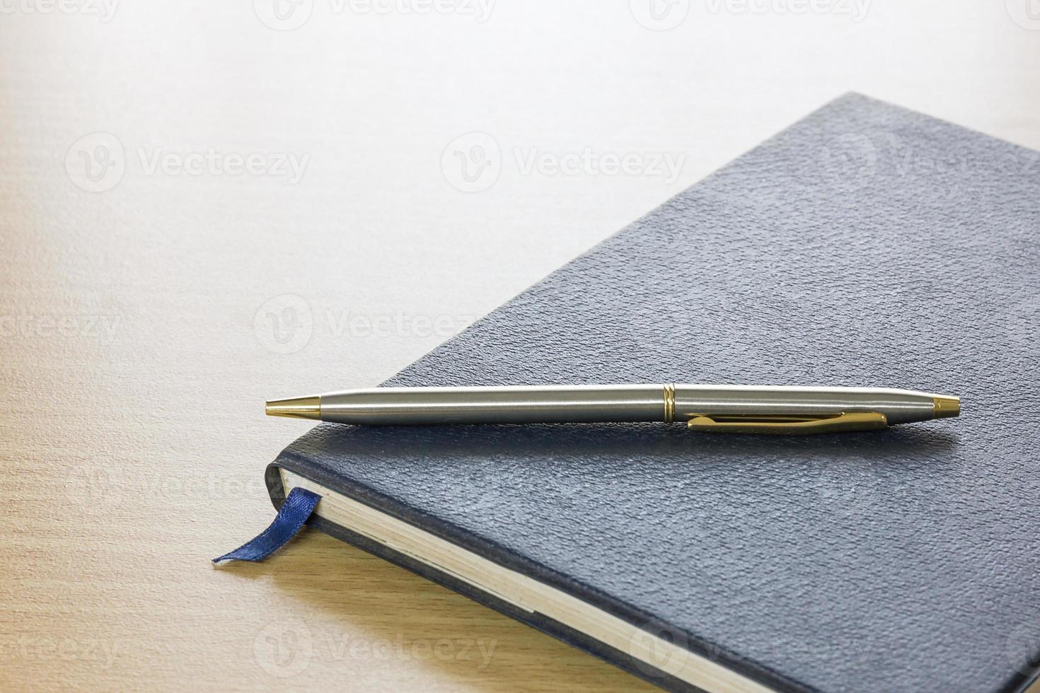 Pen on a book photo