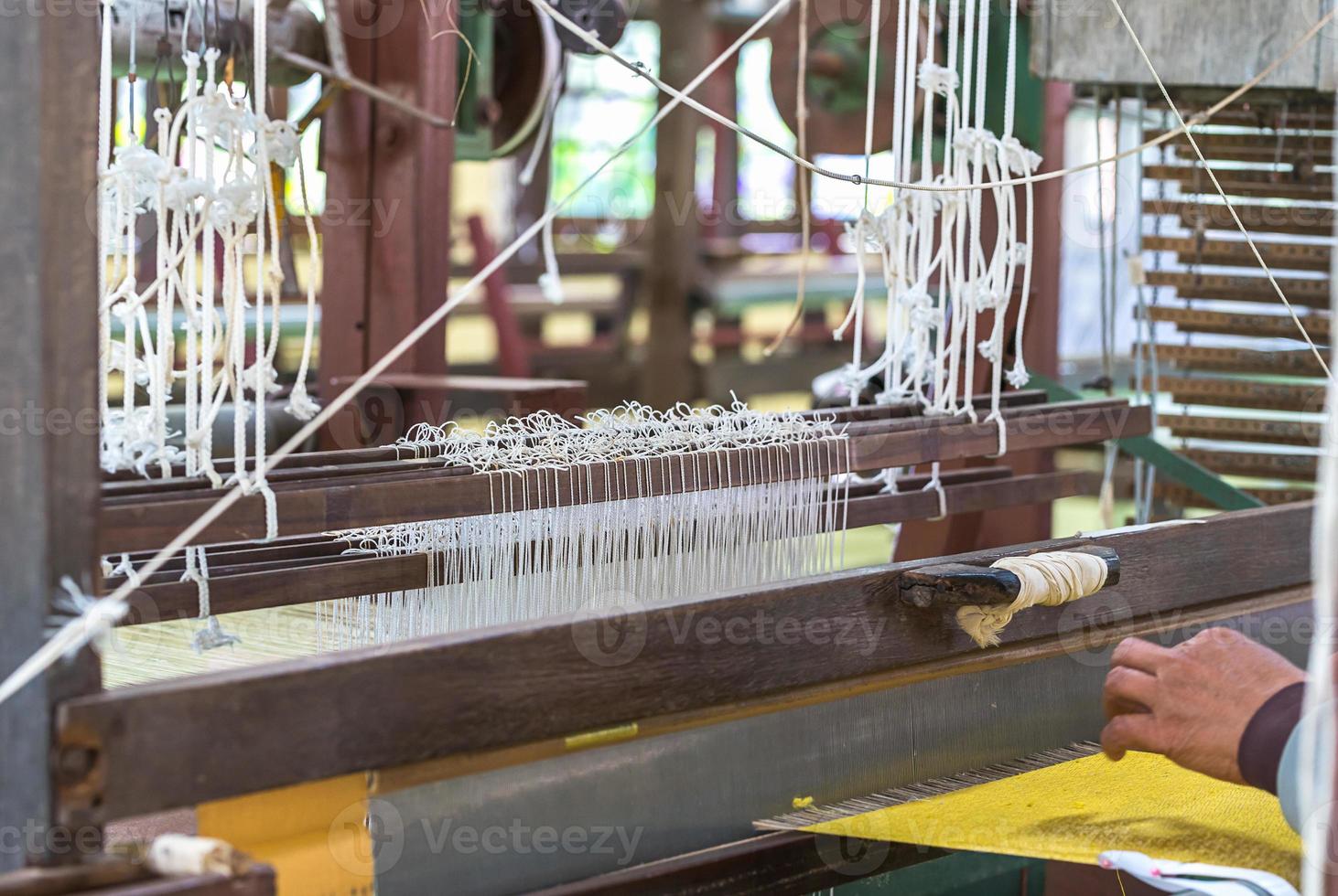 Weave silk cotton on the manual wood loom photo